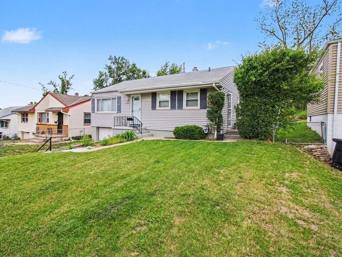 Welcome to this move-in-ready home, freshly updated and ready for its next chapter. Fresh paint, new carpet, rich wood trim, and a remodeled kitchen with white cabinetry, tiled backsplash, and a brand-new dishwasher create a warm, inviting feel throu