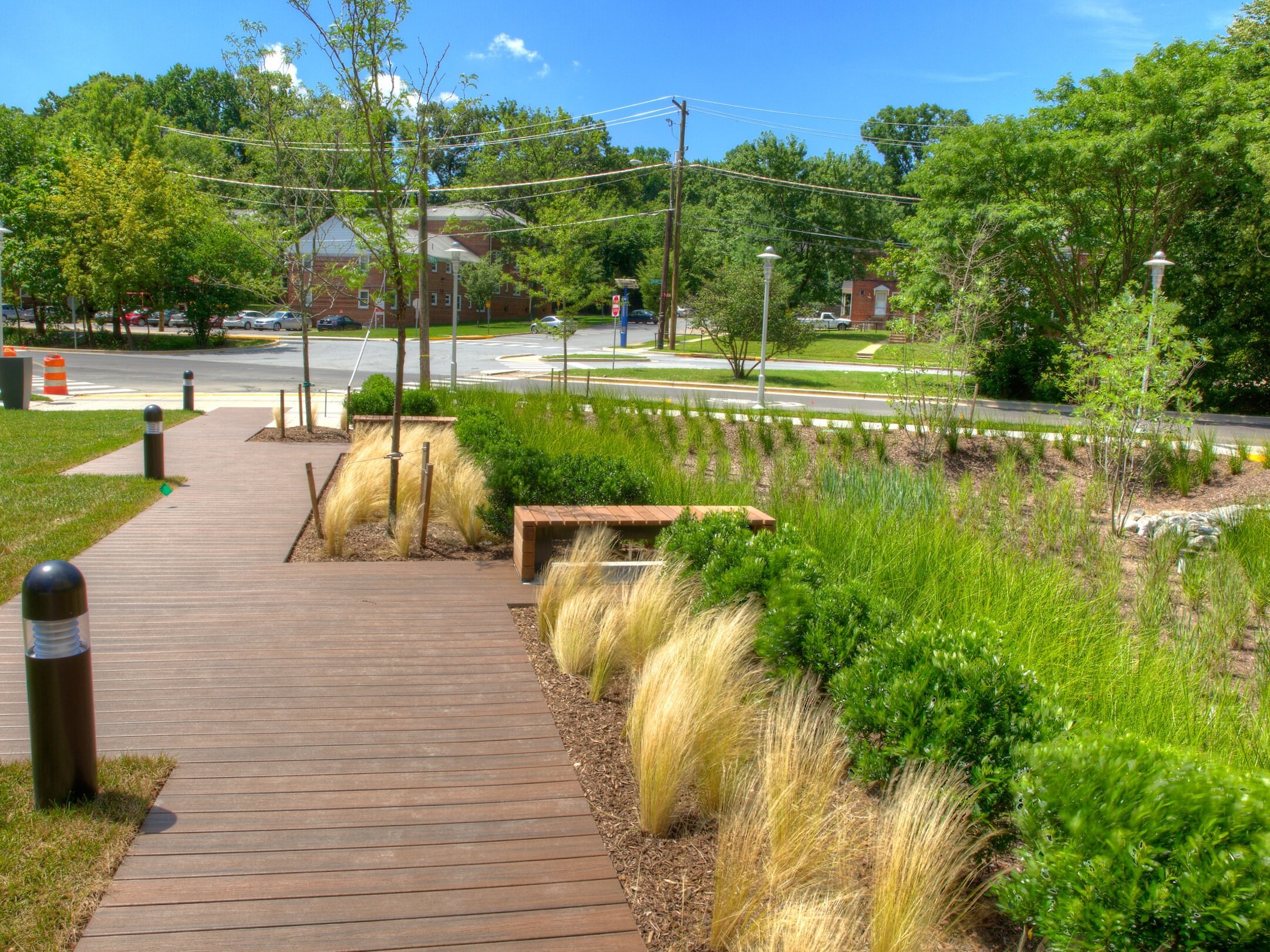   Lush plantings surround the walkways and serve as stormwater management treatment areas.  