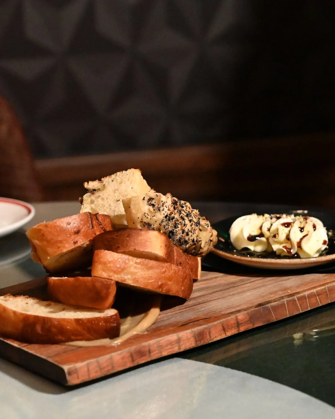 Start your night the right way 🥖✨ Haley’s Bread Board is loaded with tallow butter, crunchy pistachios, and a sweet-tangy drizzle of balsamic reduction. Worth ordering every time.