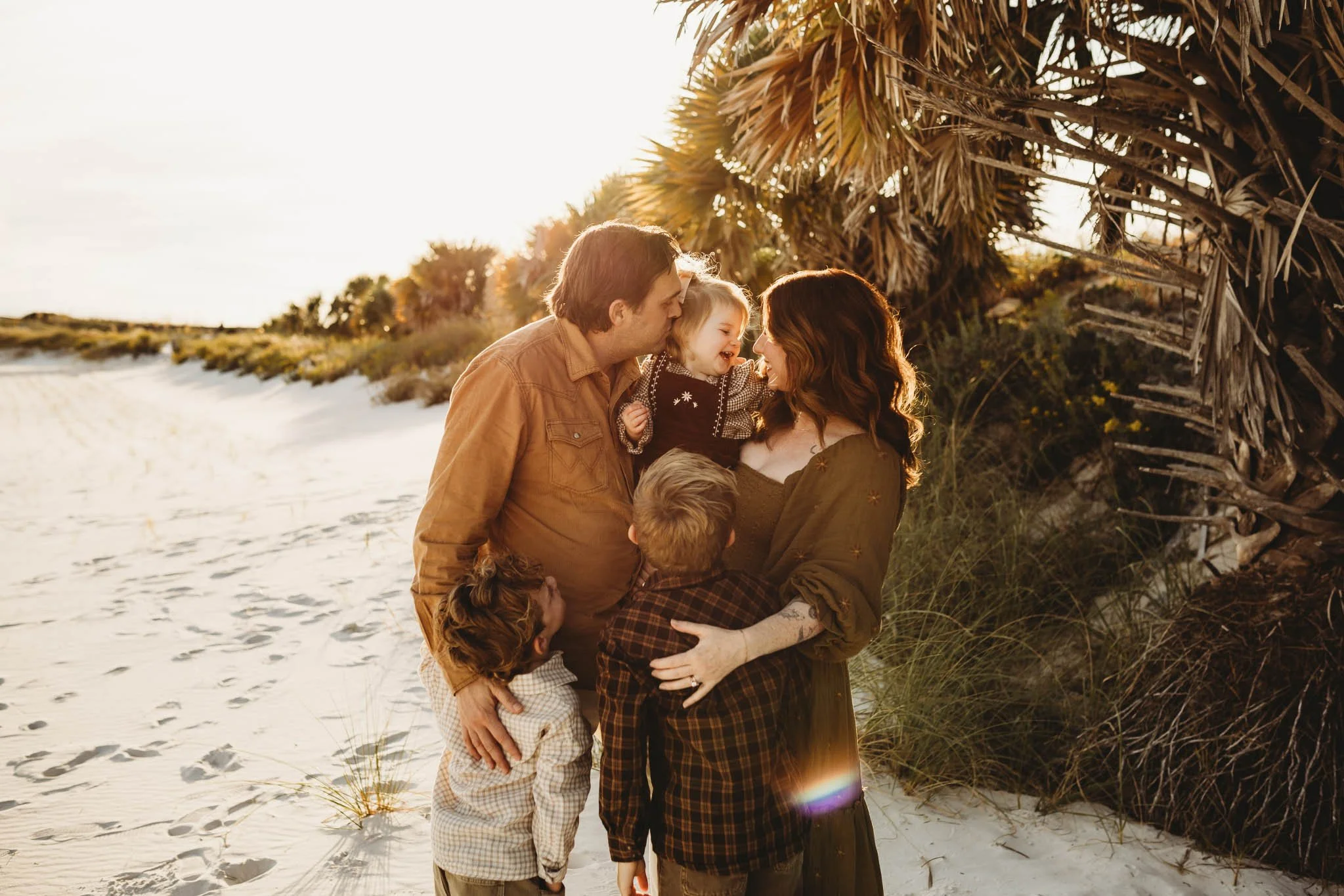Family photoshoot at the beach at golden hour