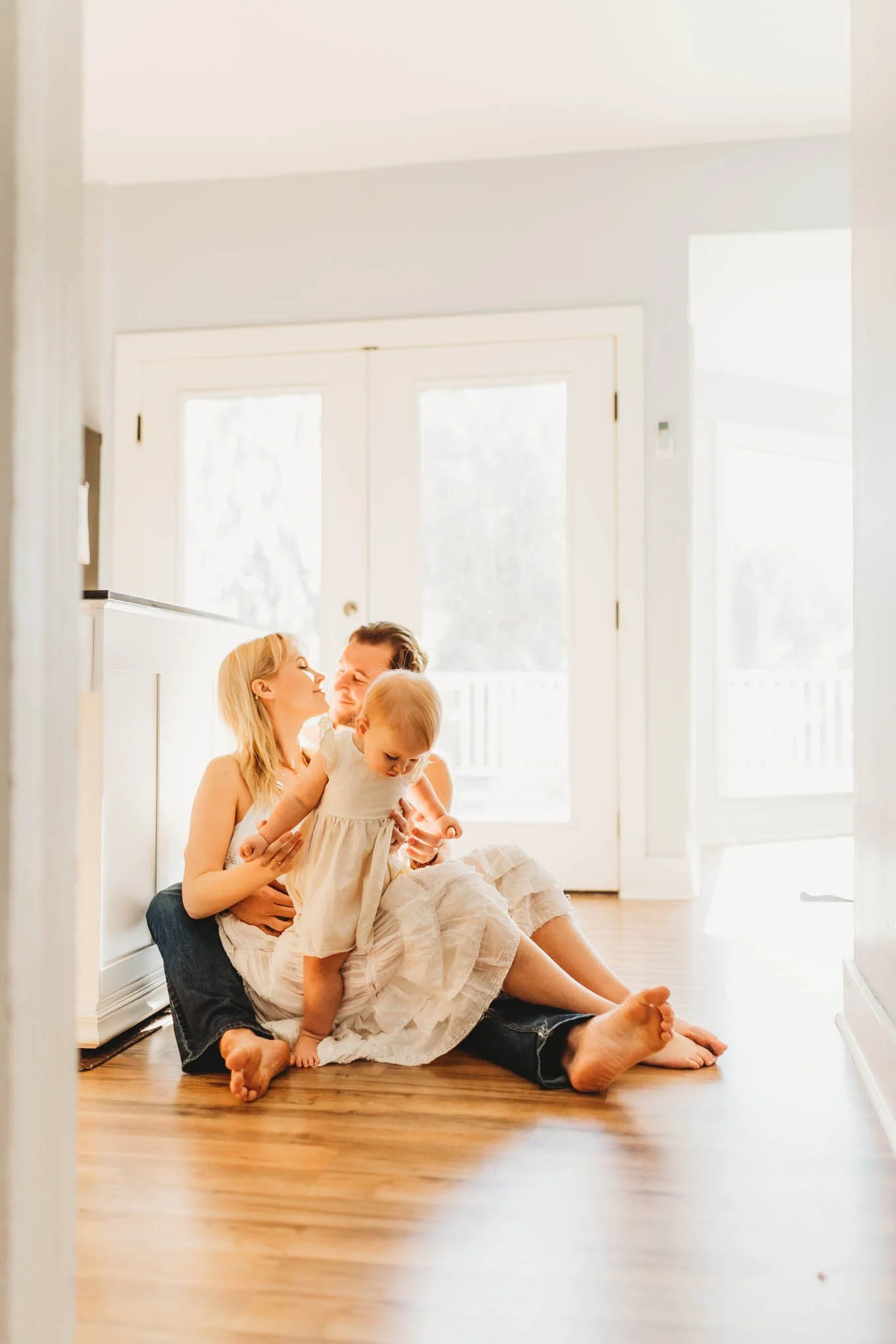Mom, dad and baby in their home in a relaxed photoshoot