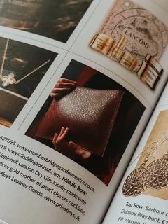 Close-up of a magazine showing Priestleys clutch bag