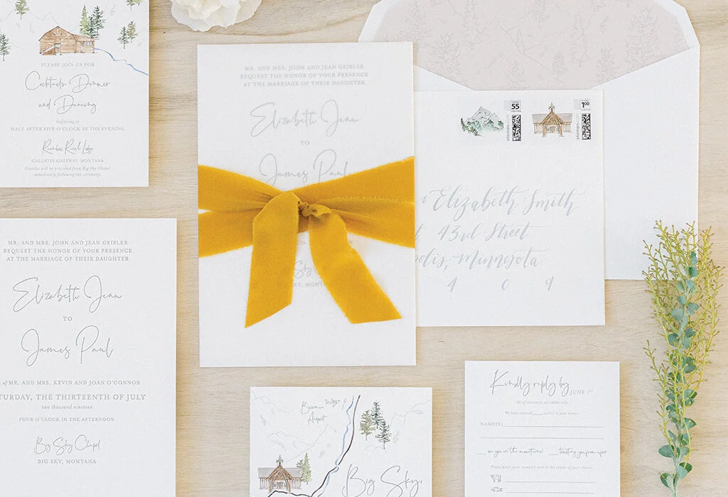 A vellum overlay, including custom watercolors of the ceremony and reception venues, is secured to the invitation with a delicate gold cord.