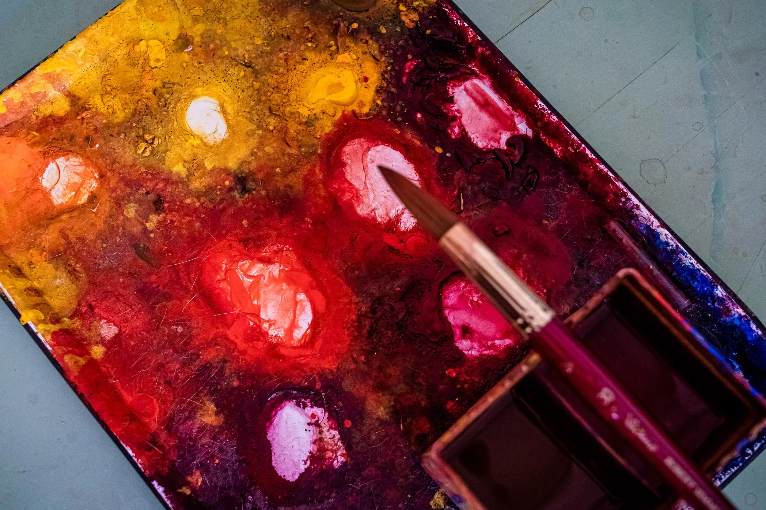 Paint brush and watercolor paint