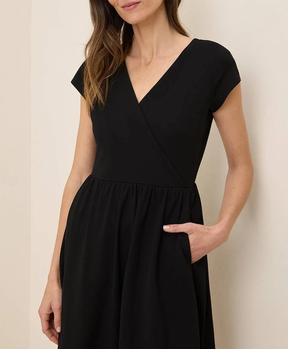 Pact 100% GOTs Cotton Fit & Flare Crossover Dress with short sleeves in the color black