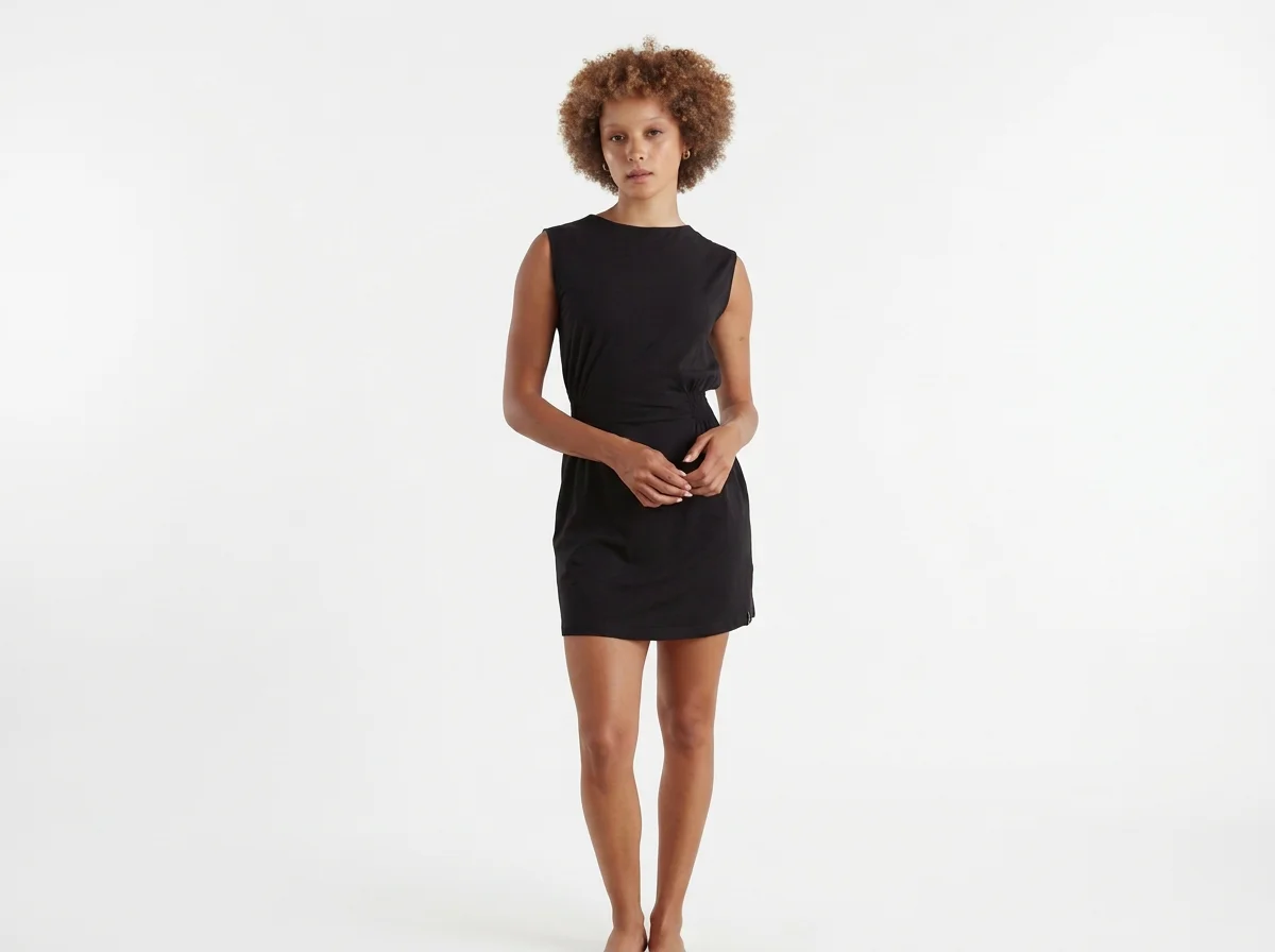 Known Supply Sandy 100% GOTs organic cotton sleeveless short dress with a smocked waist in the color black