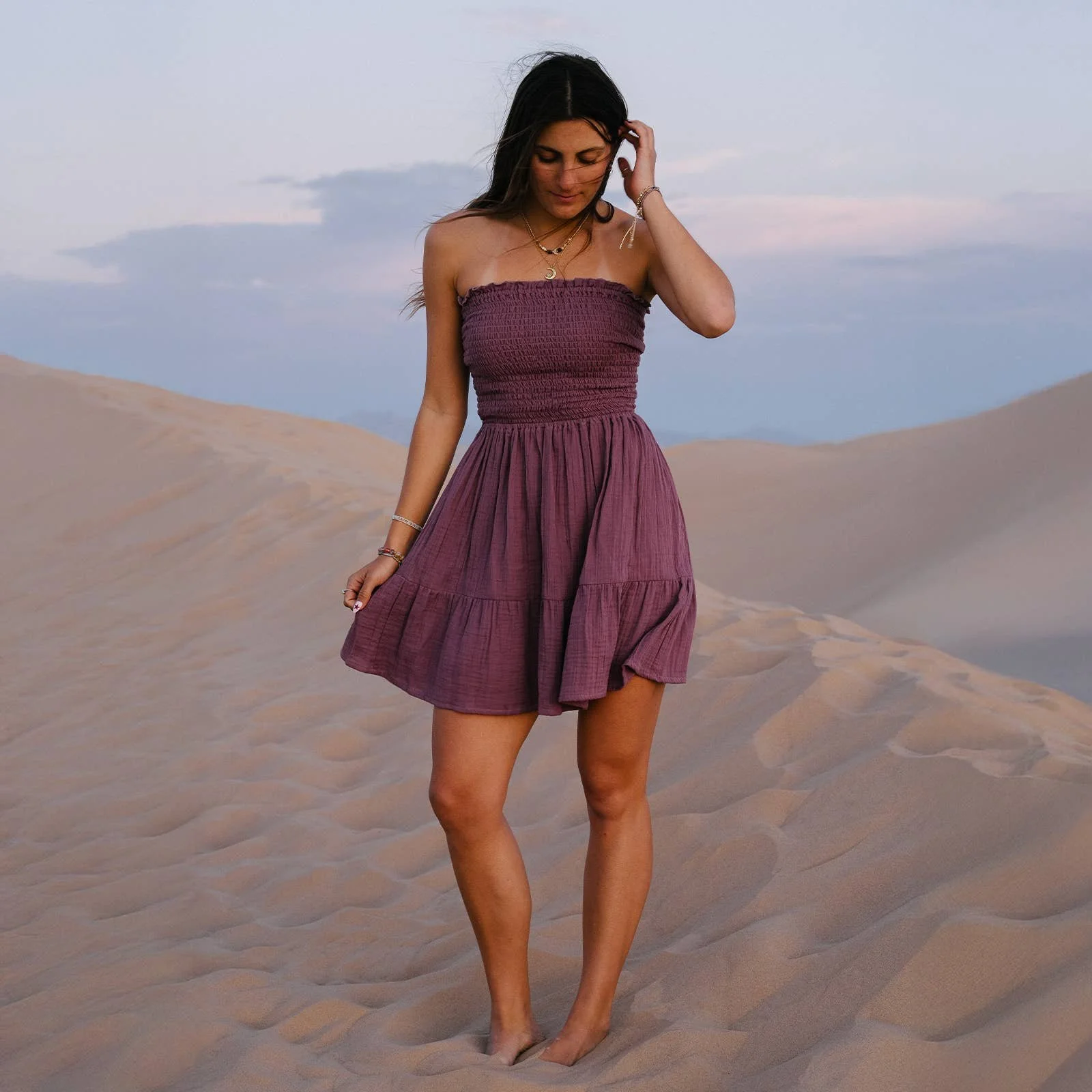 Lotus and Luna Berry Daiquiri Dress made from 100% organic cotton has a smocked bodice and tiered hem.