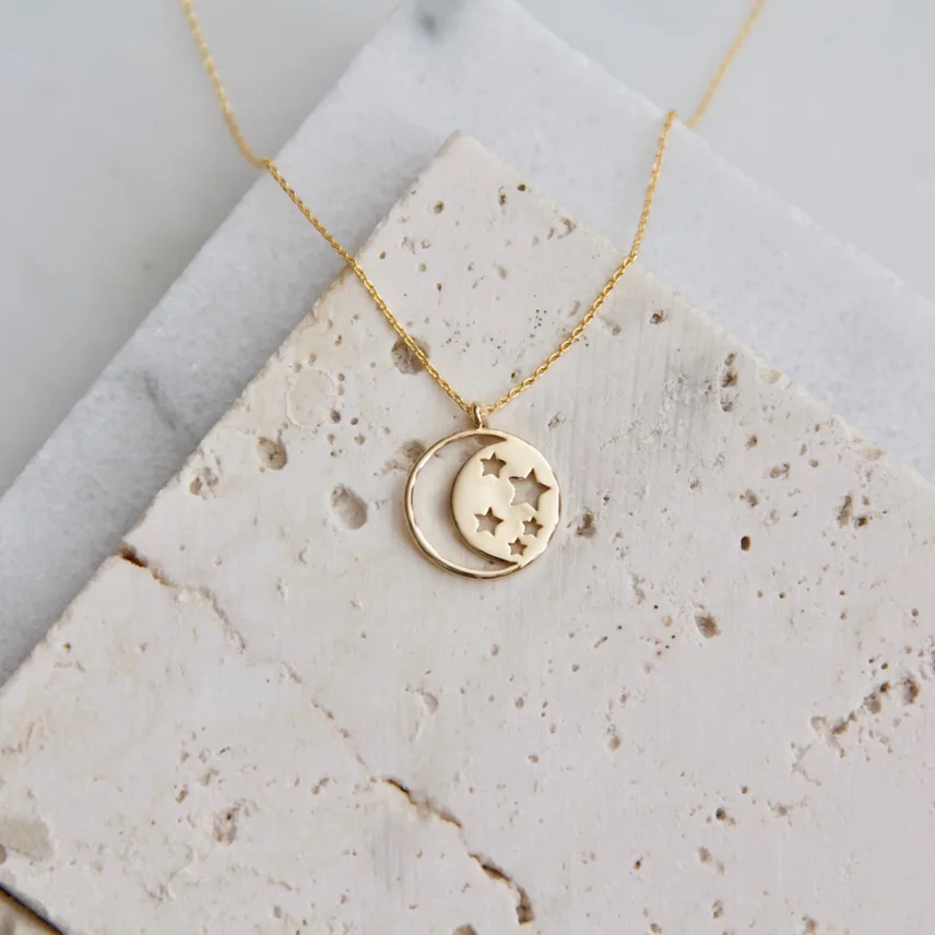 Mesa Blue Gold Celestial Necklace pendant with crescent moon and stars cut out