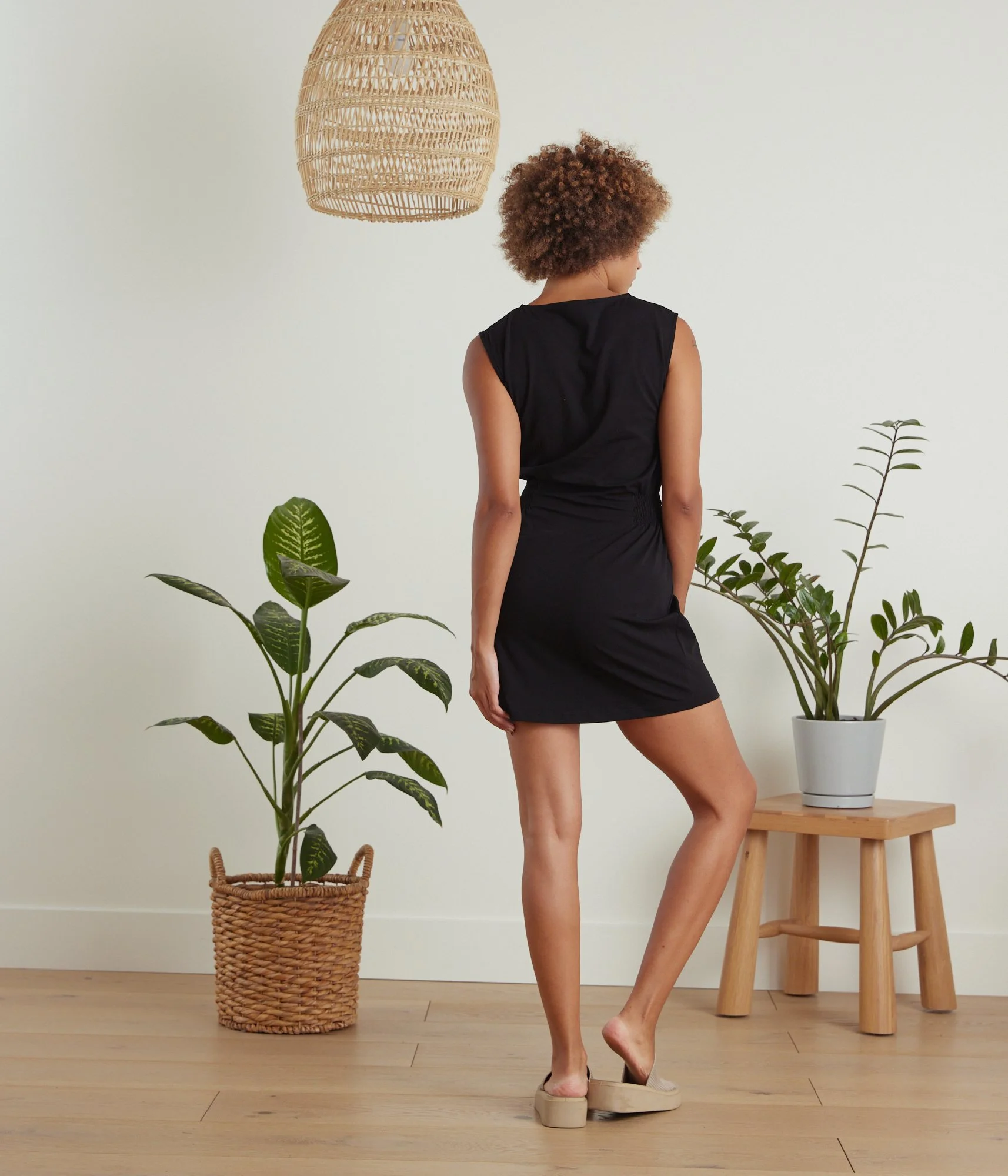 Known Supply Sandy 100% GOTs organic cotton sleeveless short dress with a smocked waist in the color black