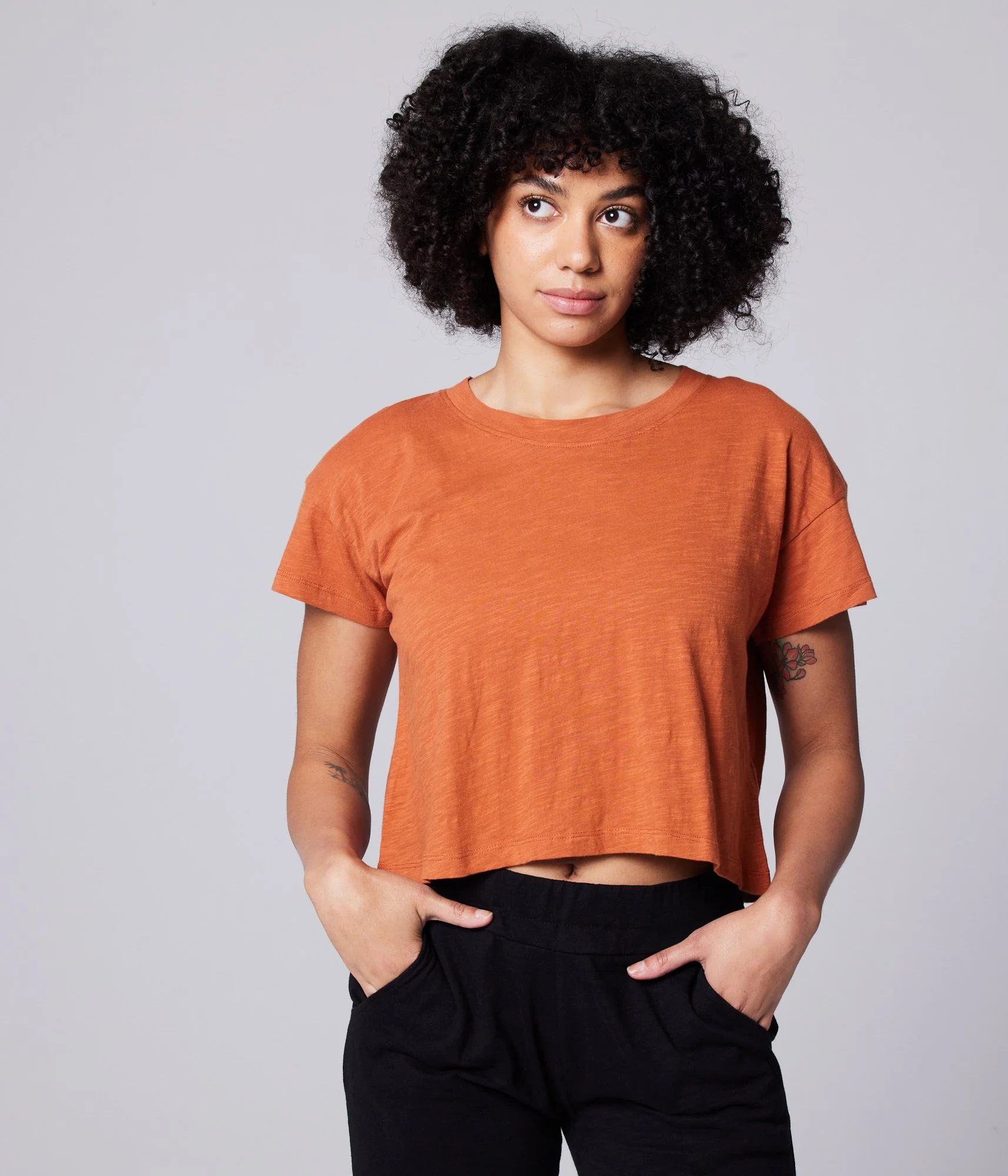 Known Supply 100% GOTs certified Organic cotton short sleeved Easy Crop Tee in the color rust