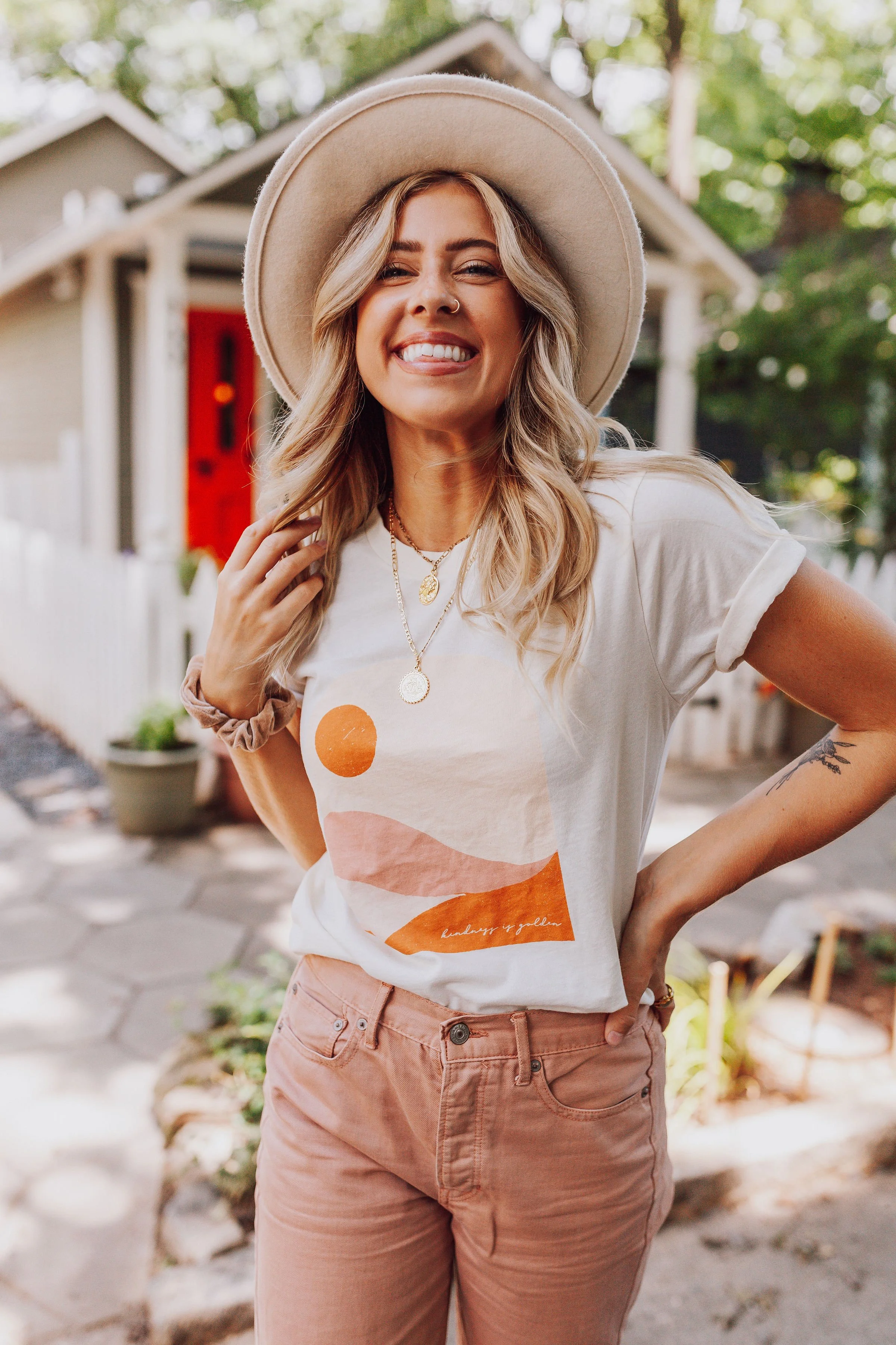 Polished Prints 100% Organic cotton graphic tee with a sunset graphic and the words "Kindness is Golden"