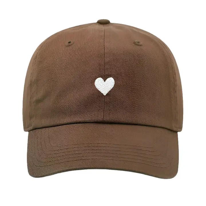 Atticus Poetry 100% cotton  pigment dyed dad hat in the color mocha with a white embroidered heart and the words "Love her, but leave her wild"