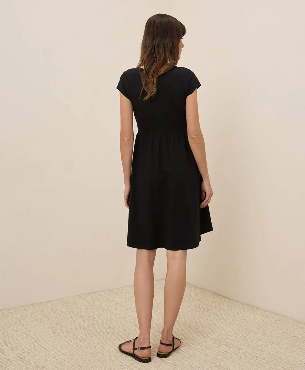 Pact 100% GOTs Cotton Fit & Flare Crossover Dress with short sleeves in the color black