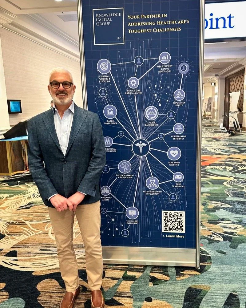 Designs in the wild 🩺! This time Knowledge Capital Group's Managing Director Anthony Powell was able to get a shot with the custom signage we collaborated on while presenting at an AMGA conference for leaders in academic medical groups. It's always 