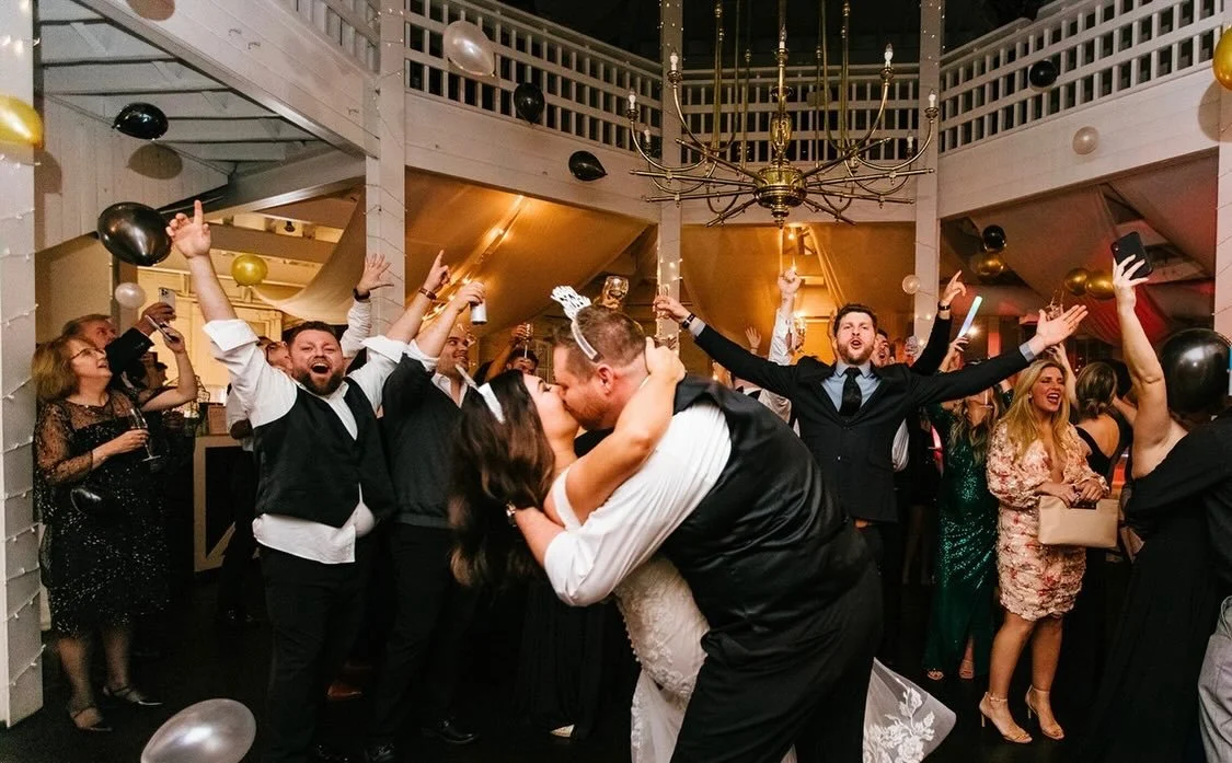 Sealing the year with a kiss and a room full of love!  This is how to ring in forever&mdash;they didn&rsquo;t just start a new year&hellip; they started a marriage ✨🪩🥂