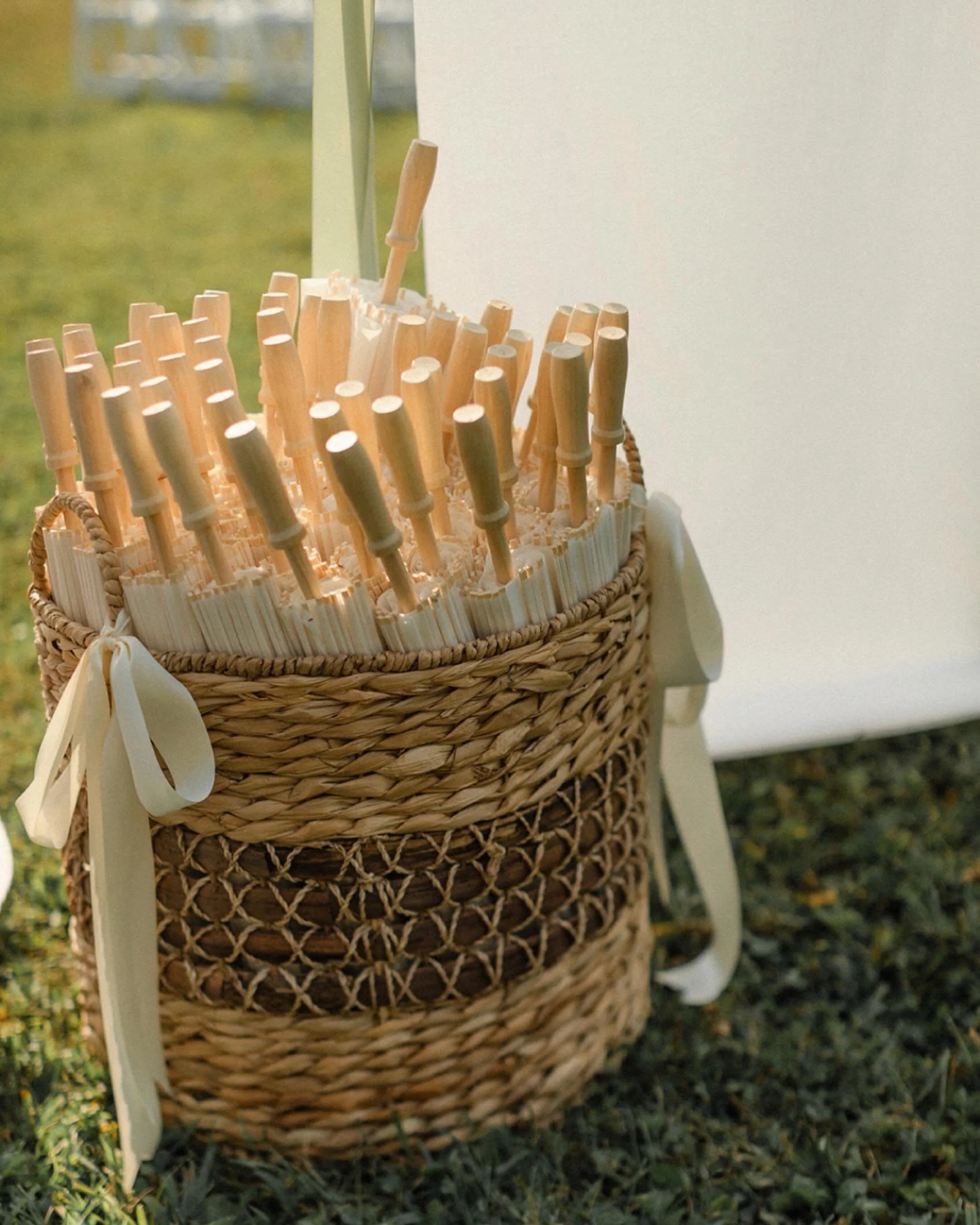 The softest kind of elegance &mdash; every ceremony + reception detail thoughtfully placed 🕊️🌿🪭♟️