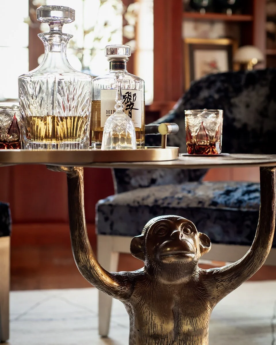 I Take My Whiskey Neat&mdash;served with a side of whimsy. 🍸✨ The playful accent table brings personality and charm to our whiskey room design, while the glassware, with its cut crystal detail, adds timeless sophistication. Proof that great design k