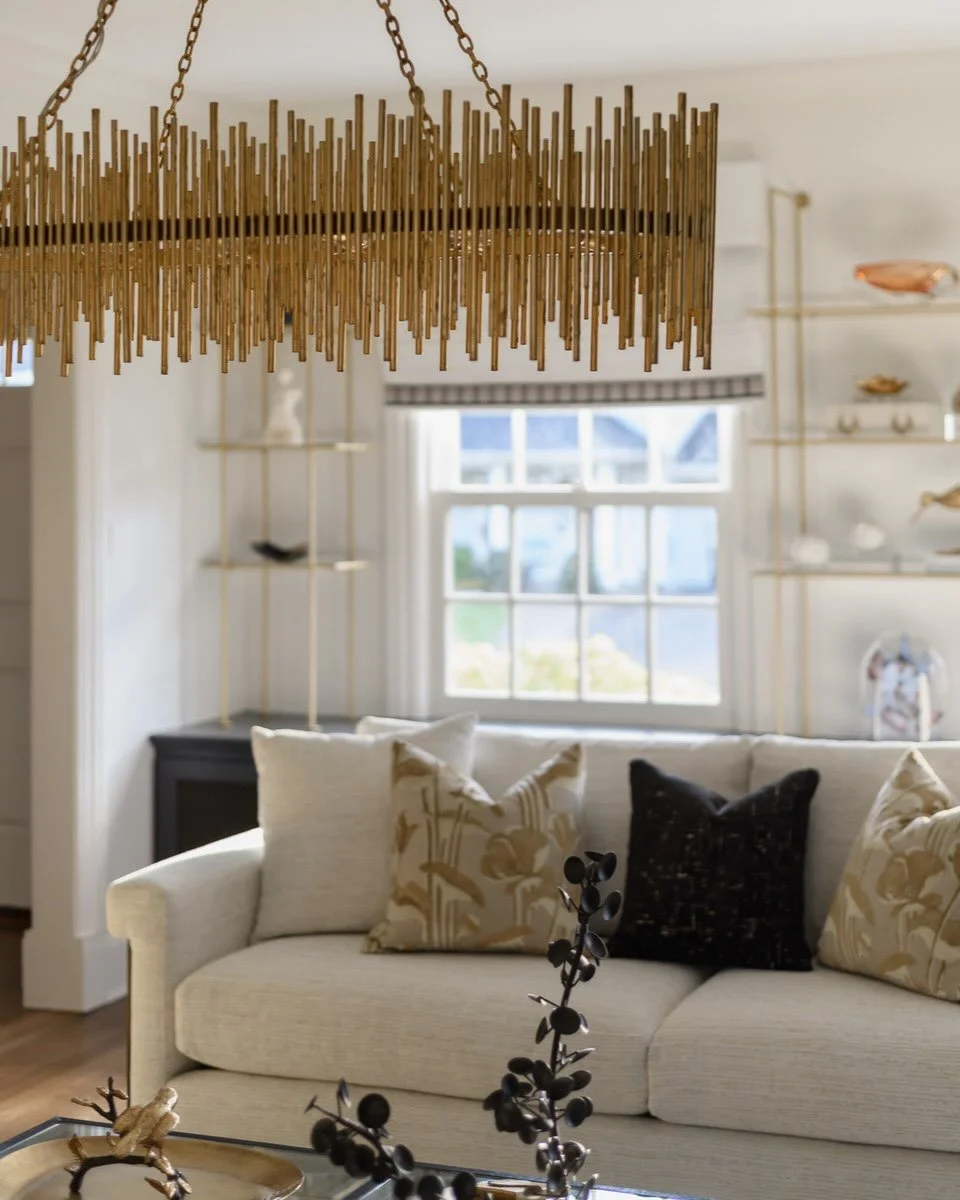 A glimpse into the layers and details that make this living room so special. From the sculptural lighting overhead to the carefully styled moments throughout, every element was intentionally selected to add depth, warmth, and personality to the space