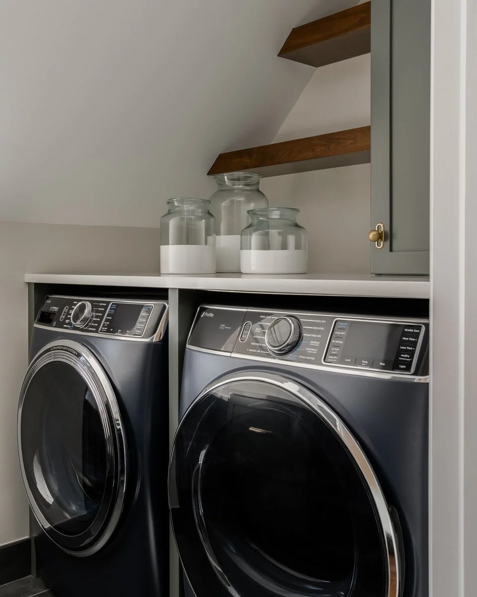Richly hued cabinets, handsome brass hardware, and a sapphire blue washer and dryer...When the room looks this good, you won&rsquo;t mind the endless piles of laundry.

#laundryroominspo #interiordesign #westfieldnj #homerenovation 

Photo credit: Me