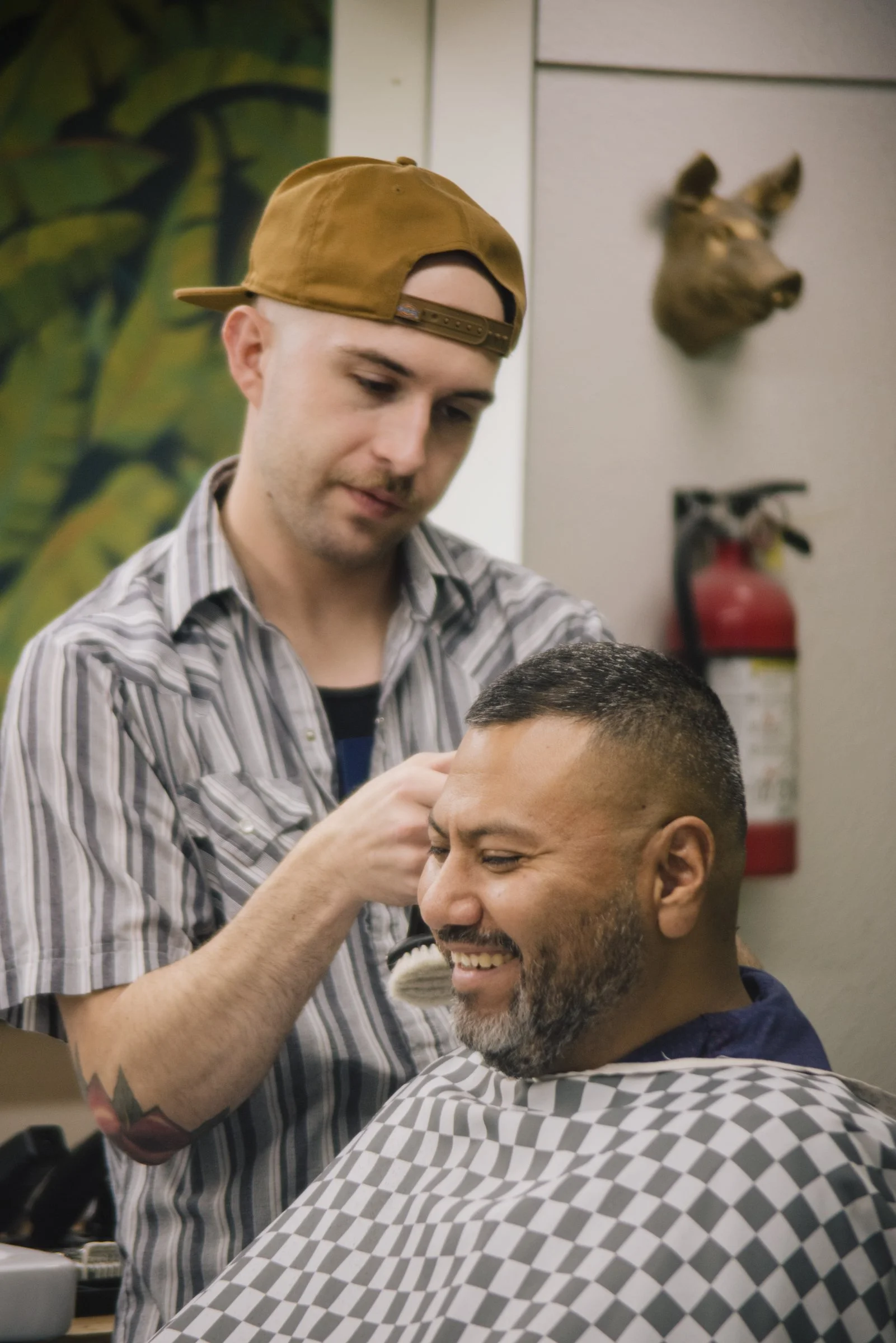 Austin barber focusing on a fade haircut at Little Barber, known for modern and classic men’s styles.