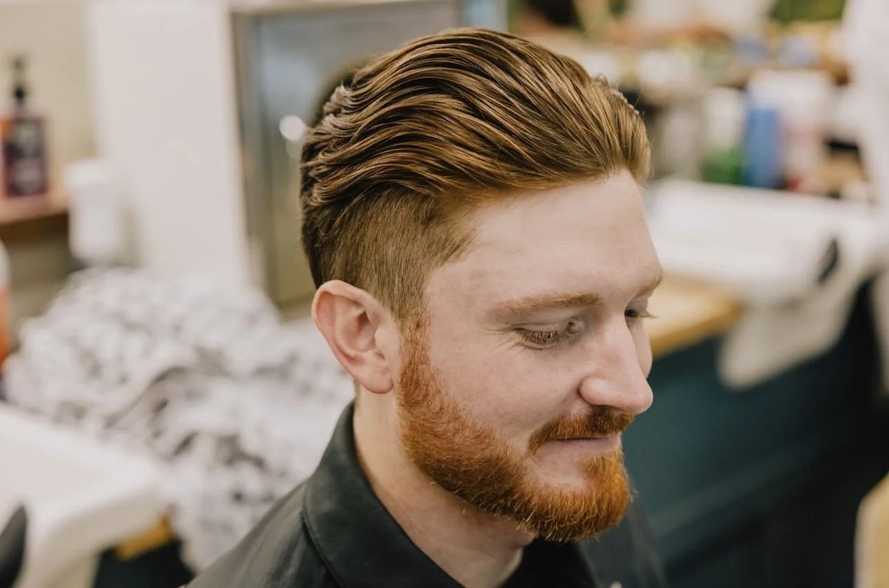 Close-up of a styled men’s haircut and beard trim at Little Barber, an Austin barbershop specializing in clean fades and classic grooming.