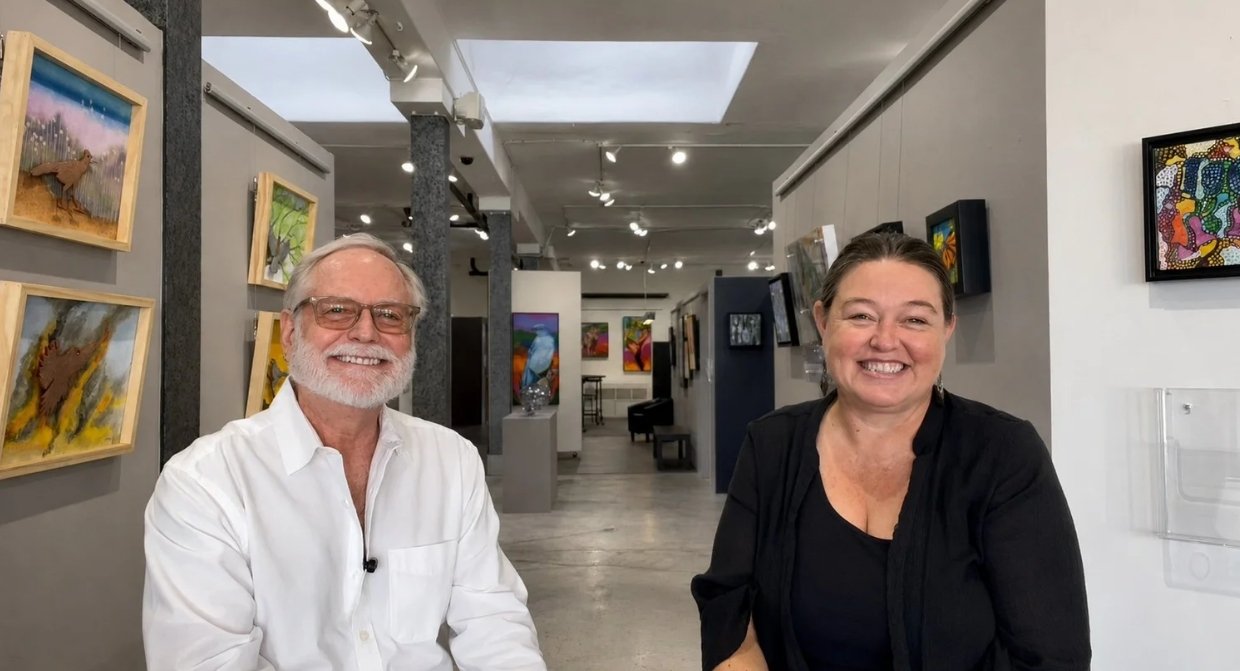 Artist Redin Winter and Gallerist Patric Stillman sit in gallery space at The Studio Door