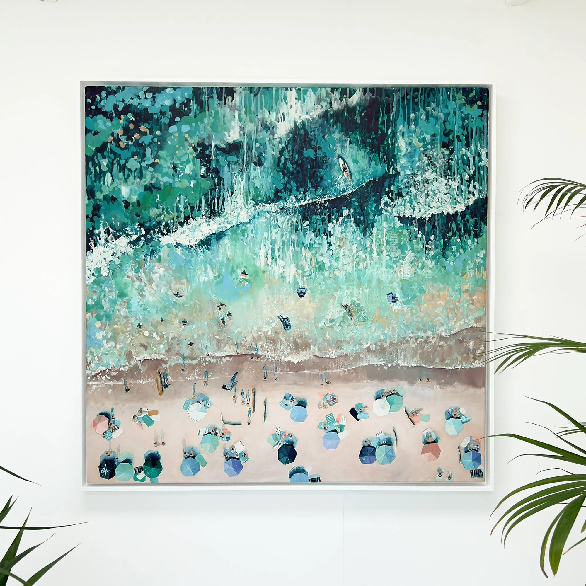 Large original aerial acrylic painting 'Drifting Shores' by Lucy Young. Features the white sands and turquoise waves of Porthcurno Beach, Cornwall, with surfers and bodyboarders.
