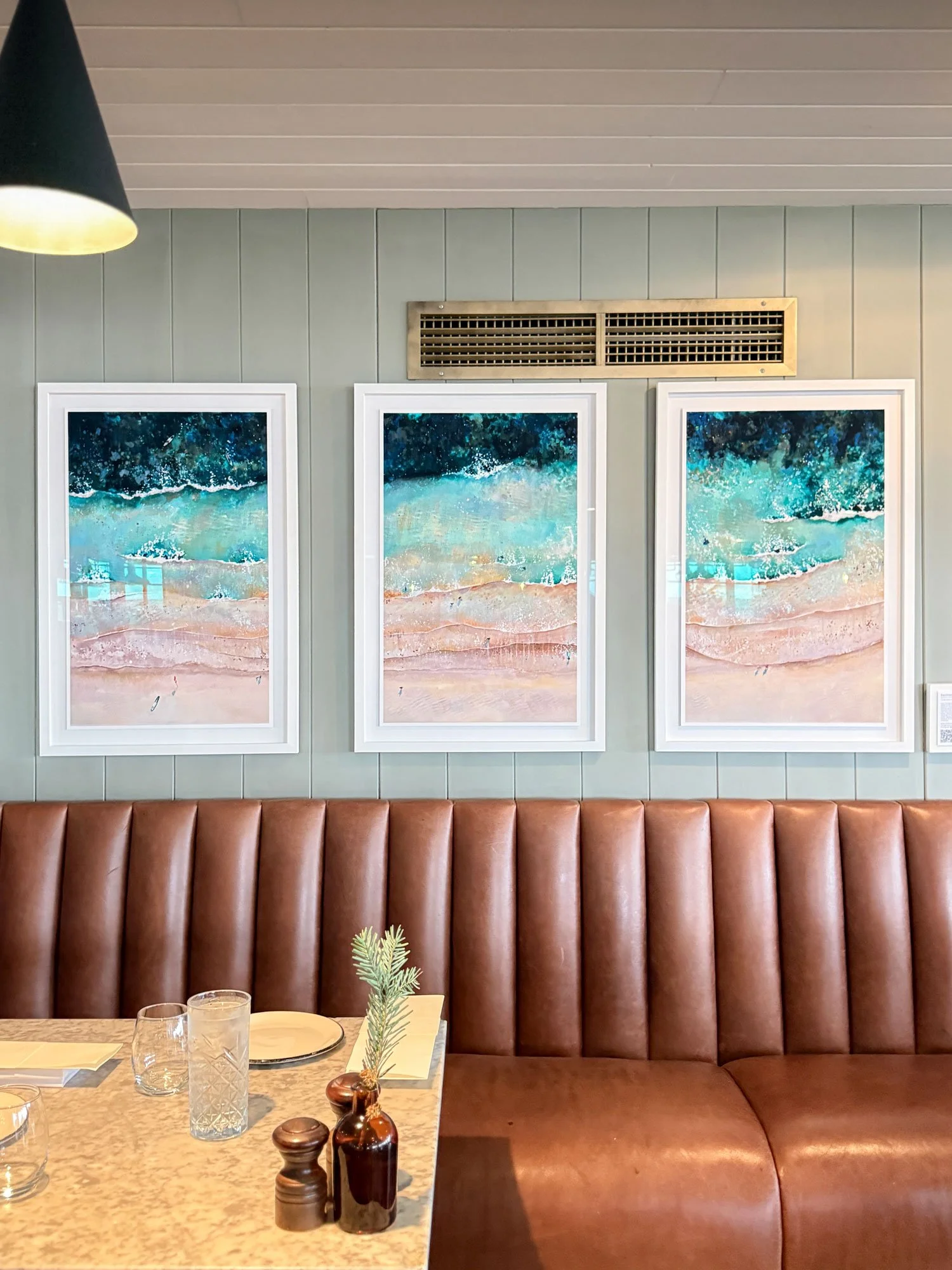 Lucy Youngs paintings of Bentham beach, hanging in gara rock hotel, Salcombe
