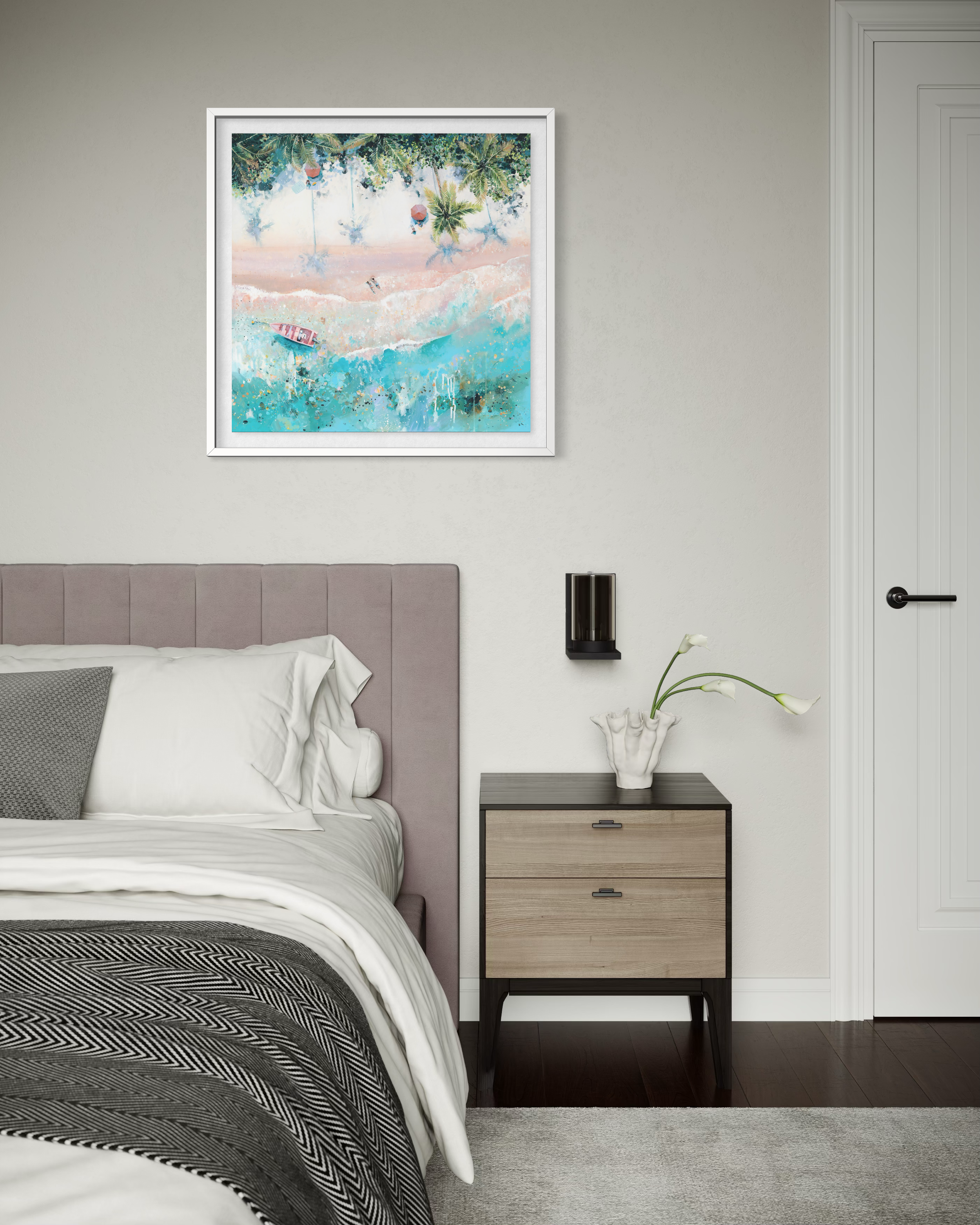 A framed Pink Paradise print styled in a bright airy bedroom with neutral pastel toned furniture.