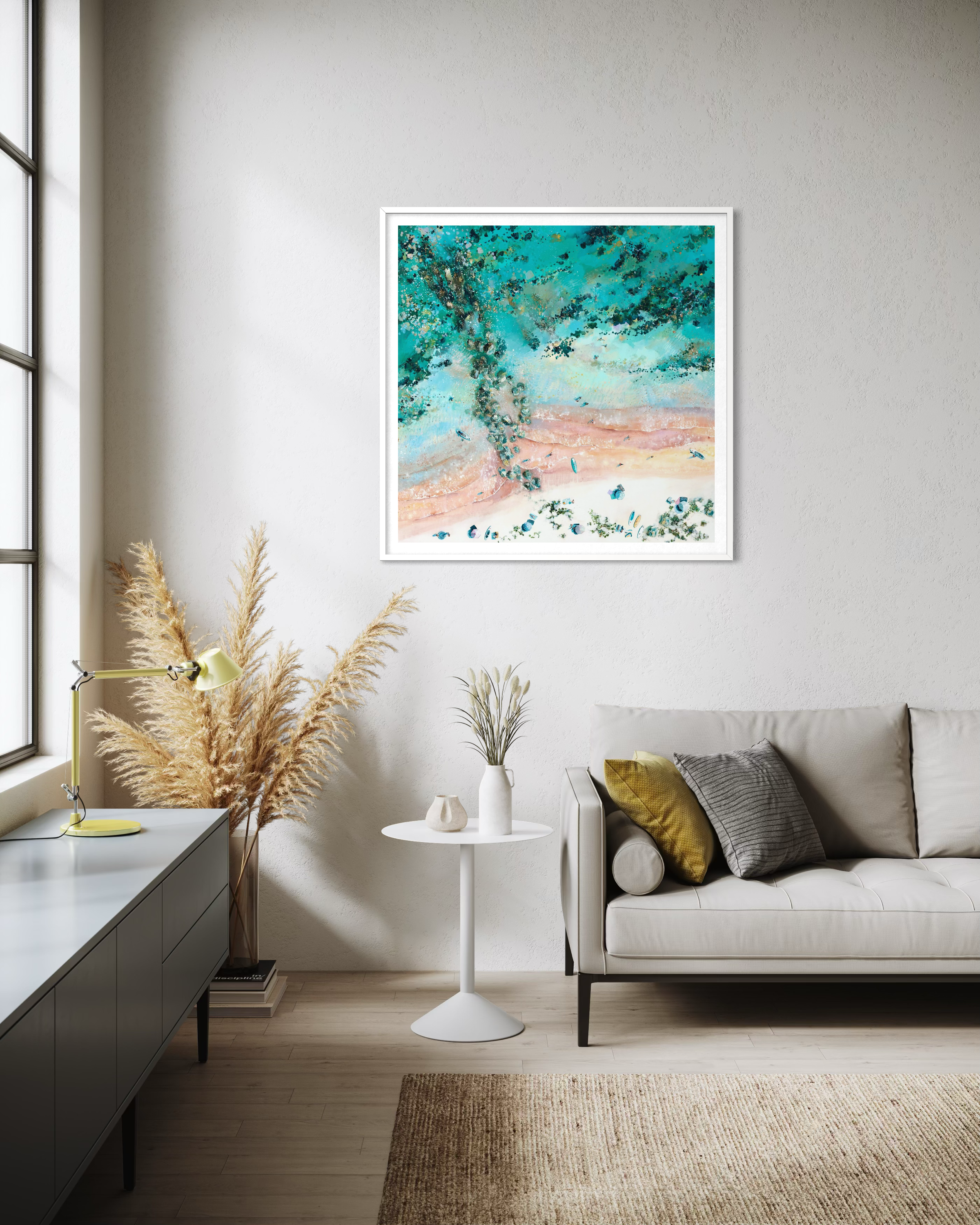 A framed Breakwaters print in a light filled modern lounge, capturing the turquoise waters of the Bournemouth coastline