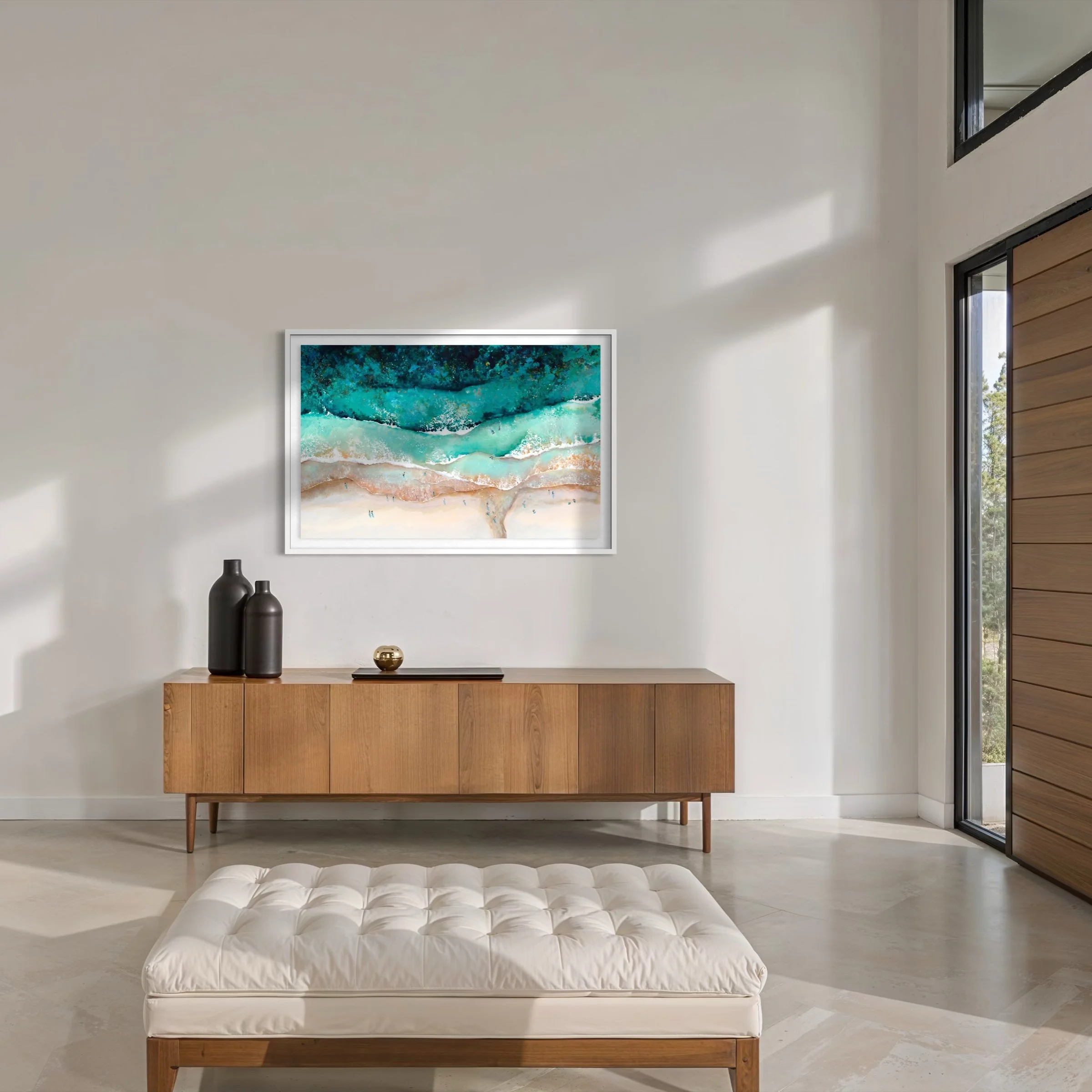 aerial beach art print of carbis bay hanging in a bright, modern coastal interior.