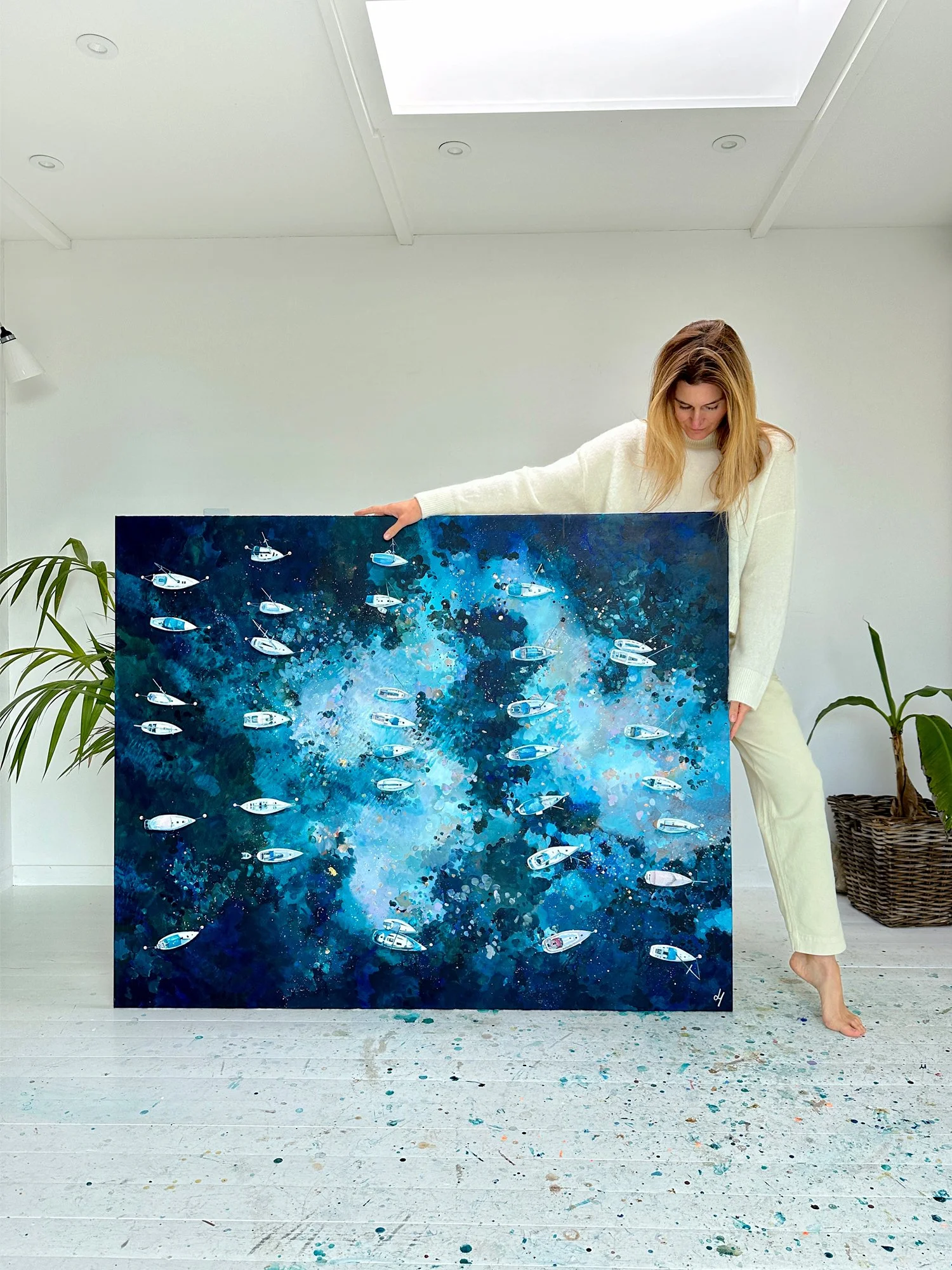 Large original aerial seascape 'Silent Blue' by Lucy Young. Features white yachts moored in deep, dark blue water in a quiet, atmospheric harbour setting.