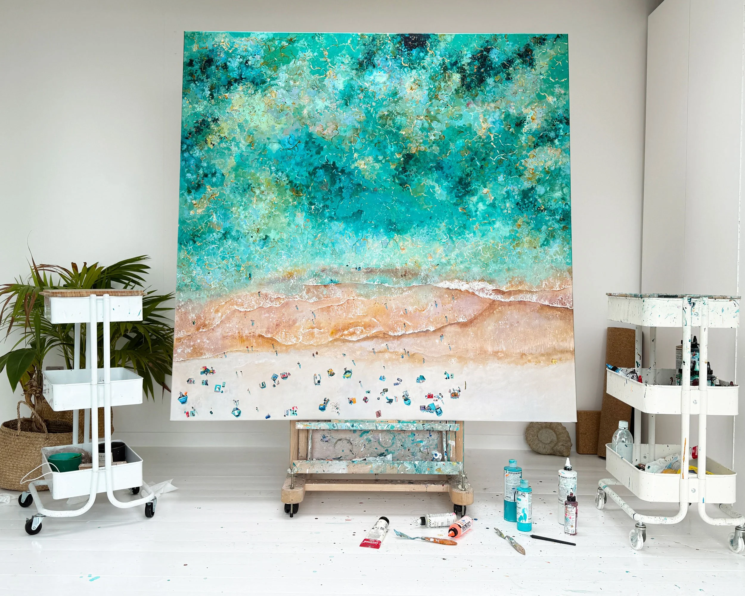 A large original aerial seascape painting on an easel in Lucy Young’s studio. The contemporary Cornish coastal artwork is shown part-finished, highlighting the professional oil painting process and Atlantic-inspired textures.