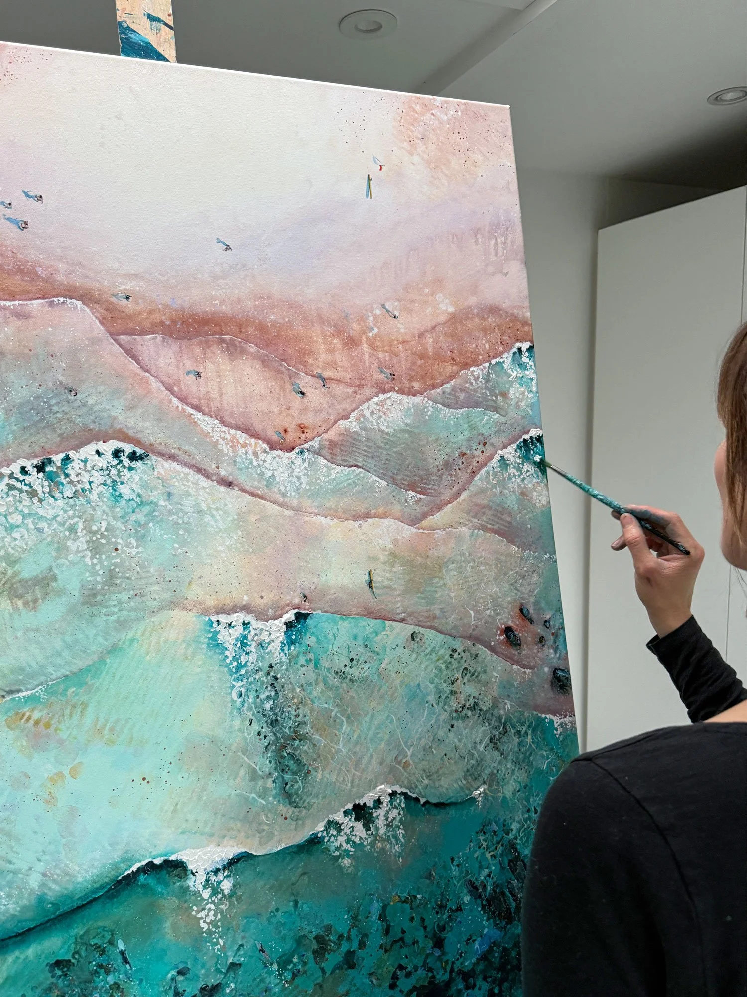 Lucy Young creating an aerial seascape for gara rock hotel.