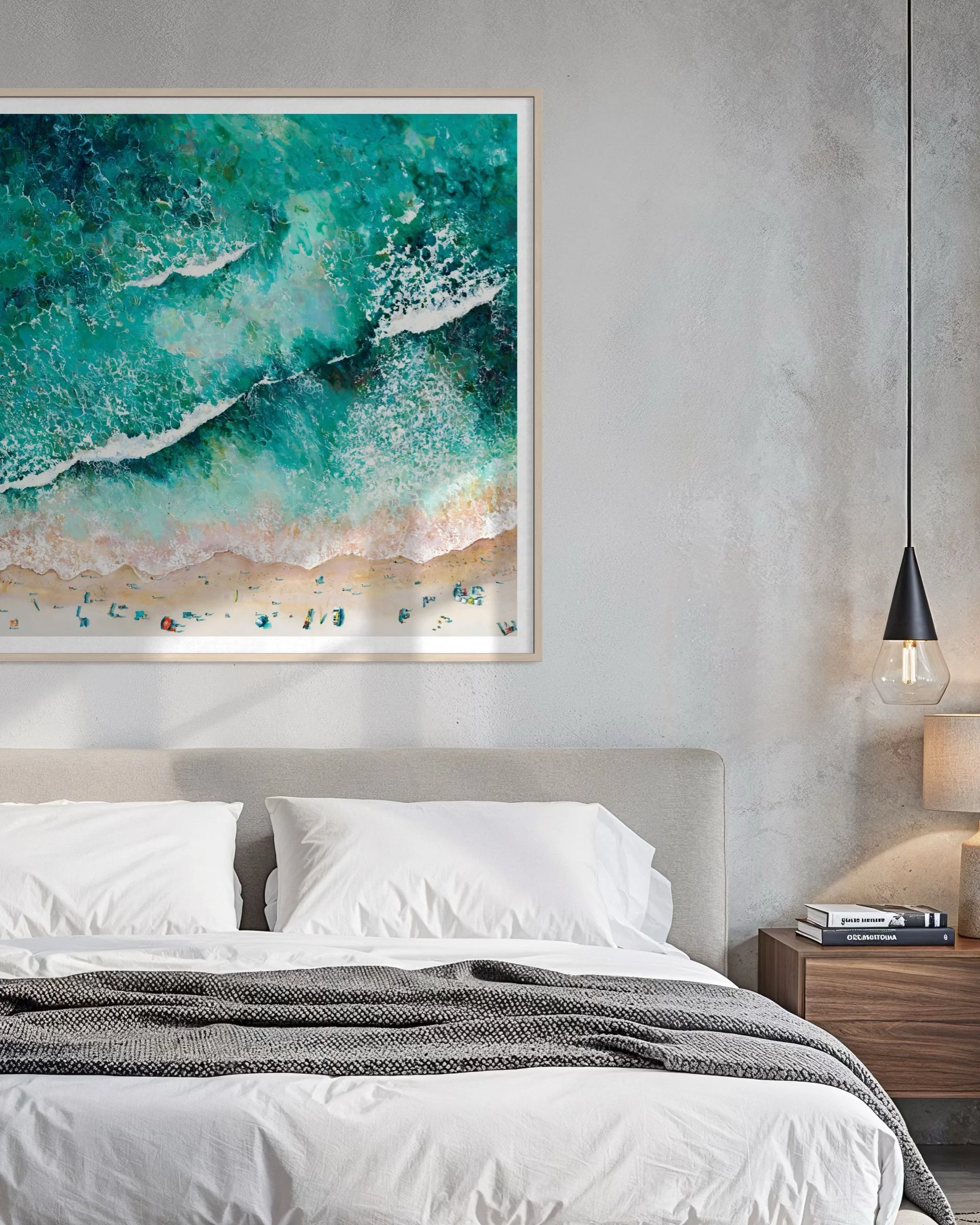 Large-scale Porthmeor Magic art print framed above a contemporary bed, showcasing Cornish coastal decor and St Ives surf art.