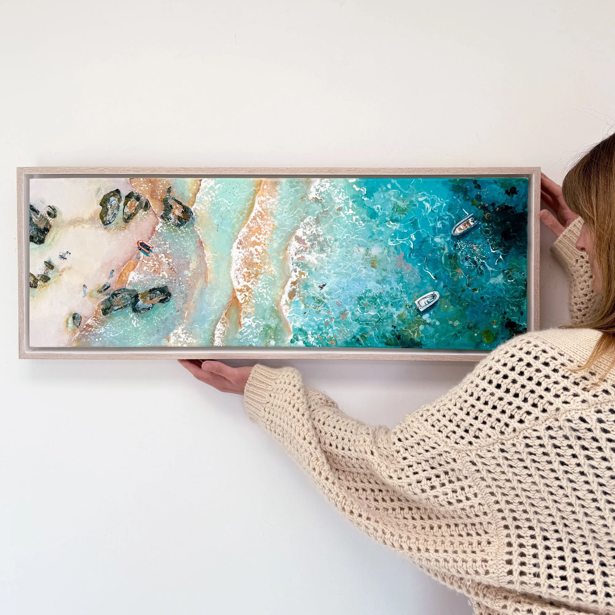 Discover "Coastal Rhythm," a panoramic original acrylic painting of a hidden South Devon cove by Lucy Young. Featuring a lone RIB boat, family explorers, golden sands, and turquoise surf. A contemporary coastal statement piece.