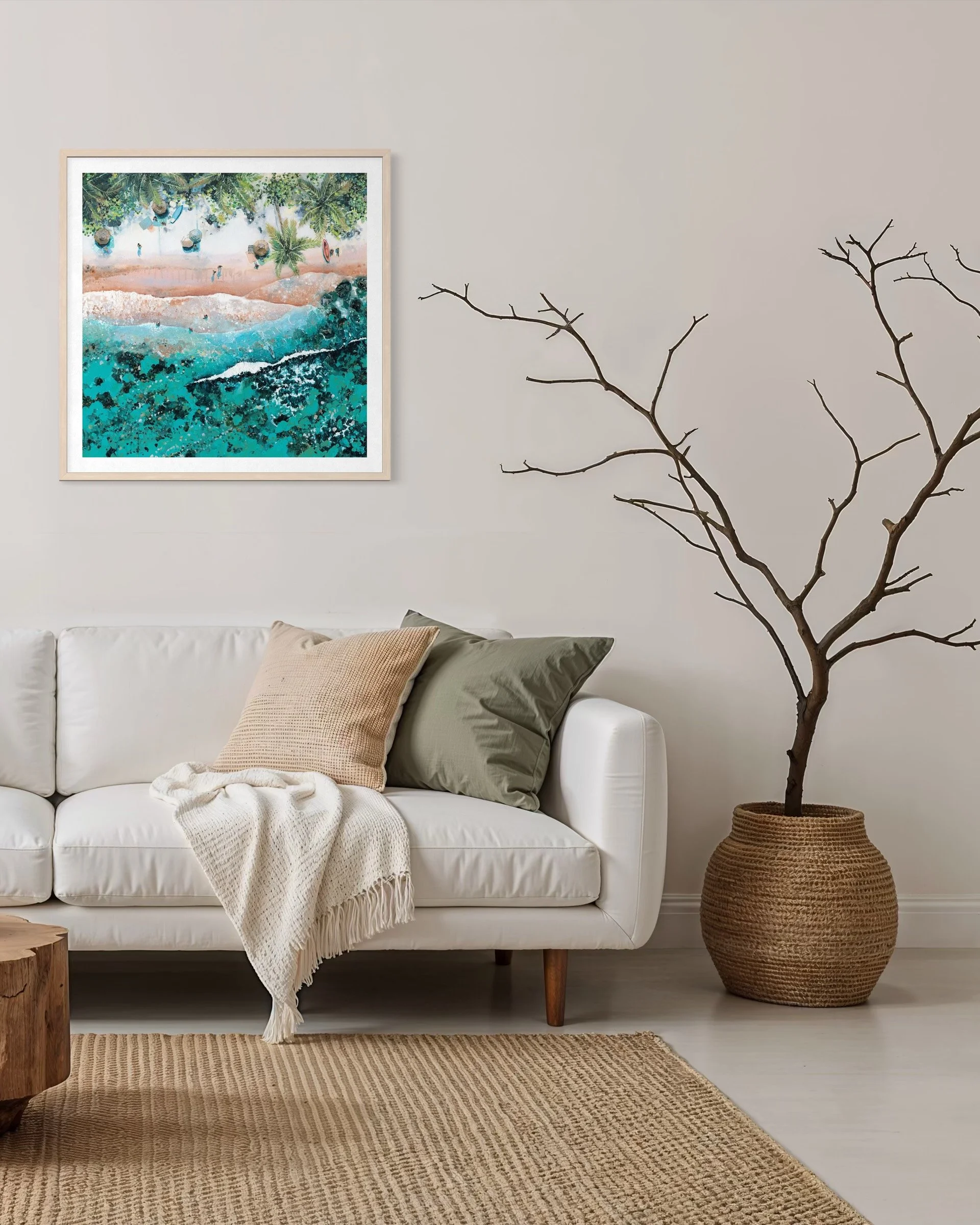 large framed Sunlit Pamls print styled in a bright, modern room with indoor plants and natural sofa and rattan furniture.