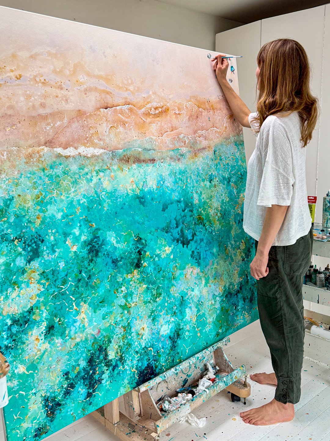 Original 1.5m x 1.5m painting 'Heart takes Flight' Lucy young creating an original painting in het studio, showing the impact of large-scale coastal art.⁠