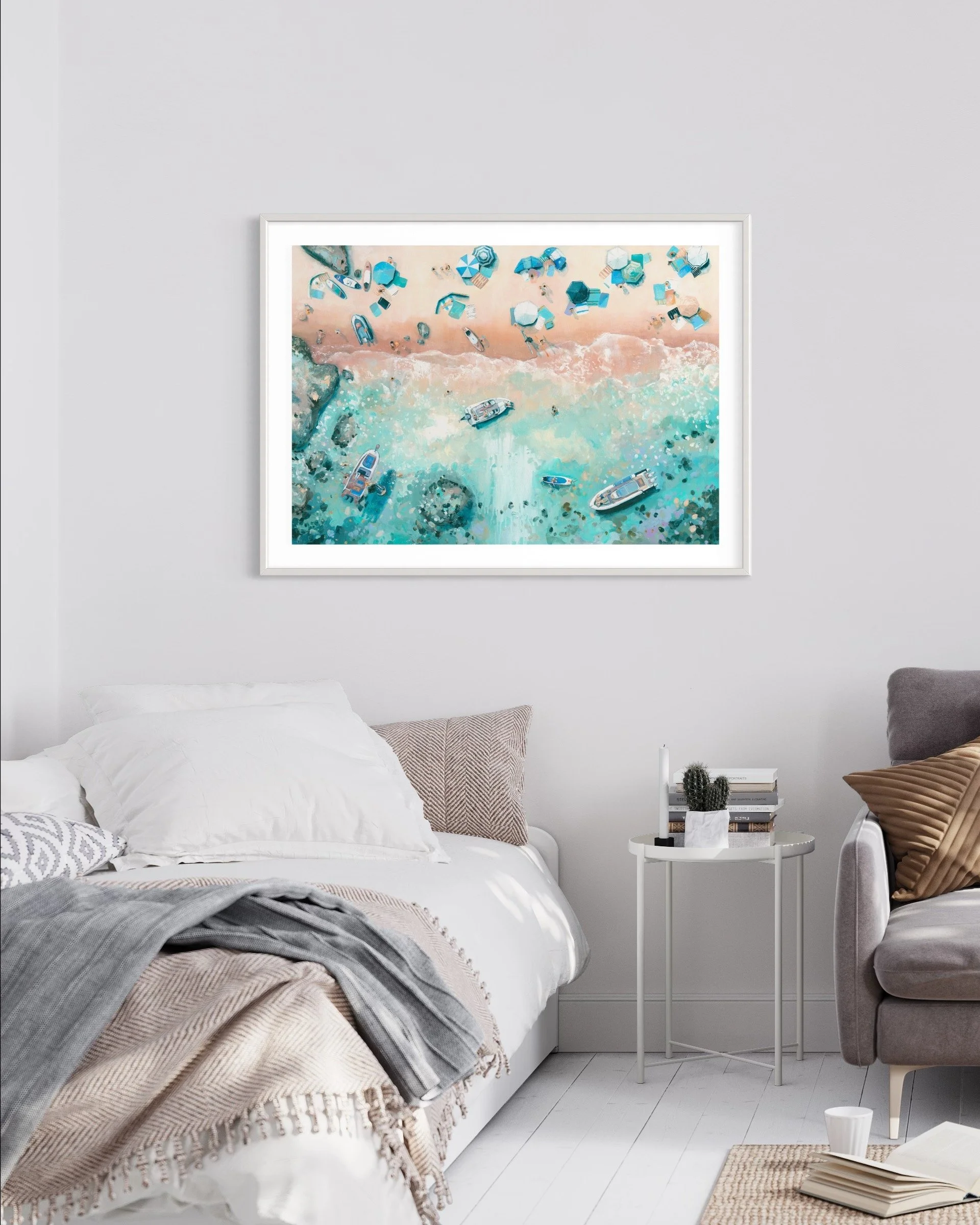 The Sea Glass Cove print in contemporary bedroom with neutral furnishings, capturing the pastel tones of a busy summer on Sunny Cove beach, Salcombe
