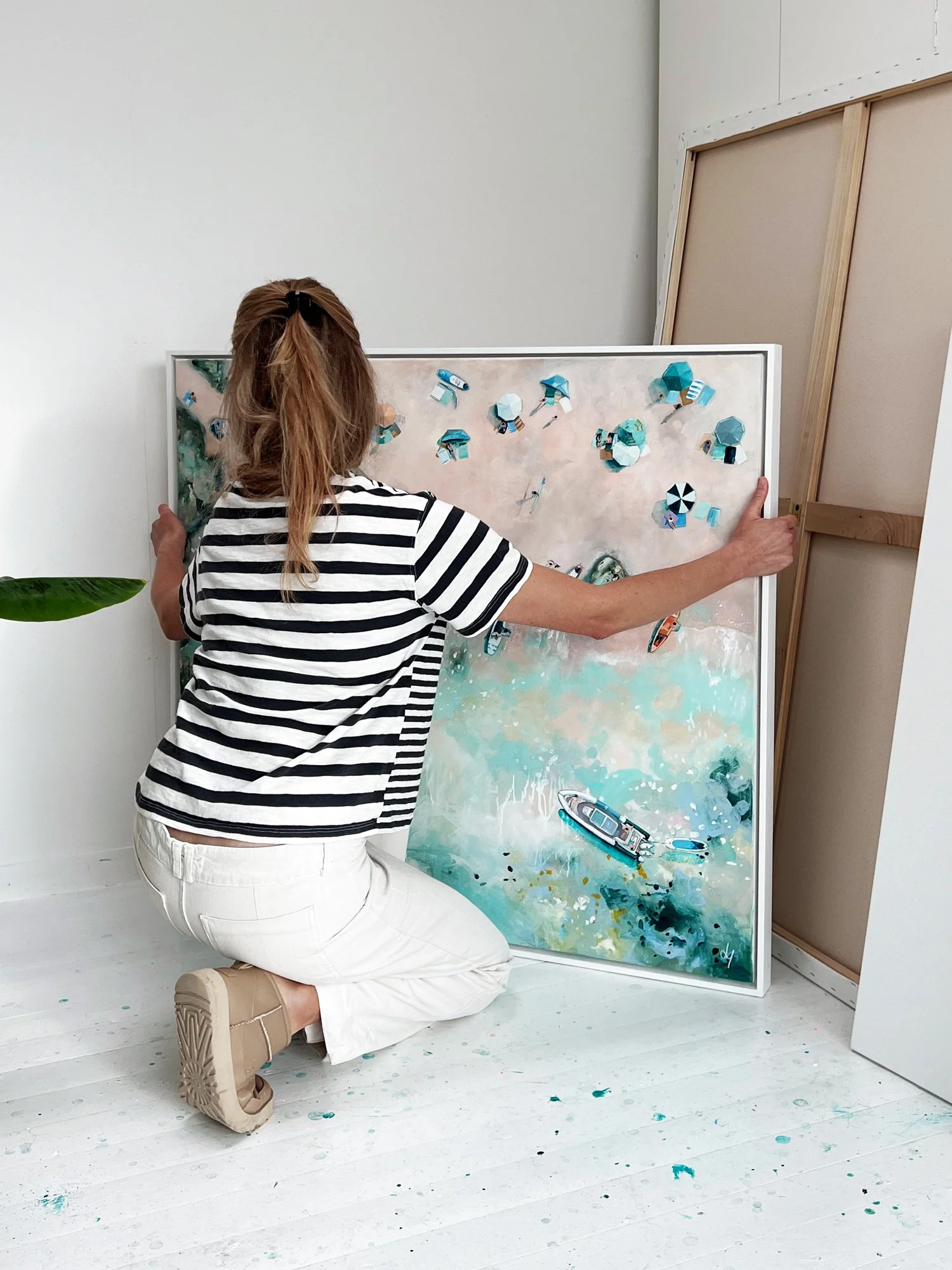 Large original aerial acrylic painting 'From Land to Sea' by Lucy Young. Features a crowded Sunny Cove beach in Salcombe with many boats and pastel-toned water.