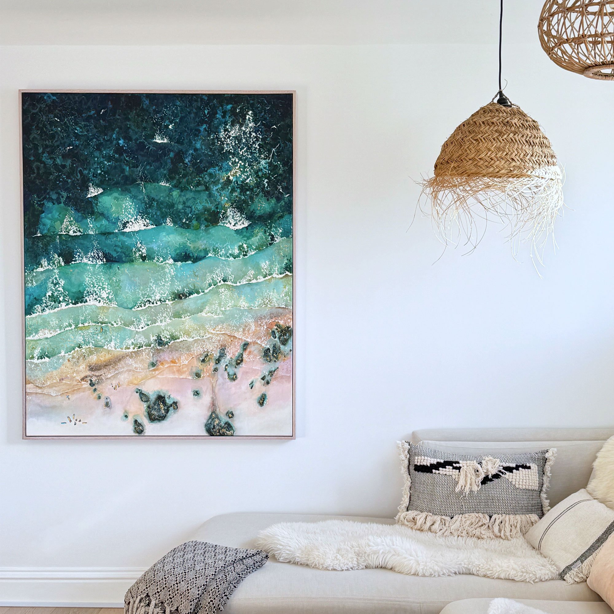 Large original acrylic painting 'Graceful Gwithian' by Lucy Young. Features dark blue rolling surf, coastal rocks, and a surf school on Gwithian Beach, st ives bay, Cornwall.