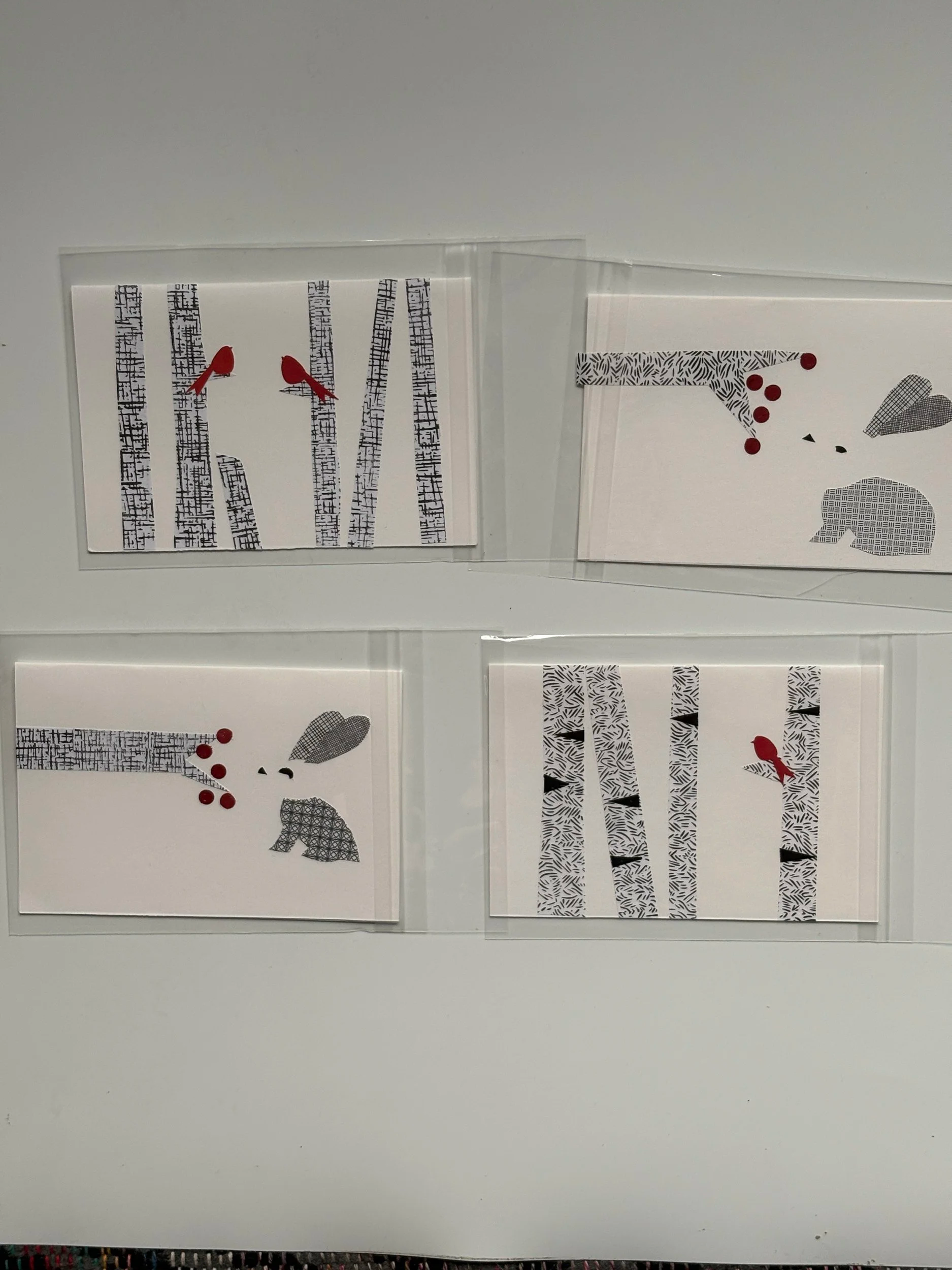Wintry note cards - made from junk mail/security envelopes. Two rabbits and two cardinals in trees. Can be mixed and matched with other cards in the series. 