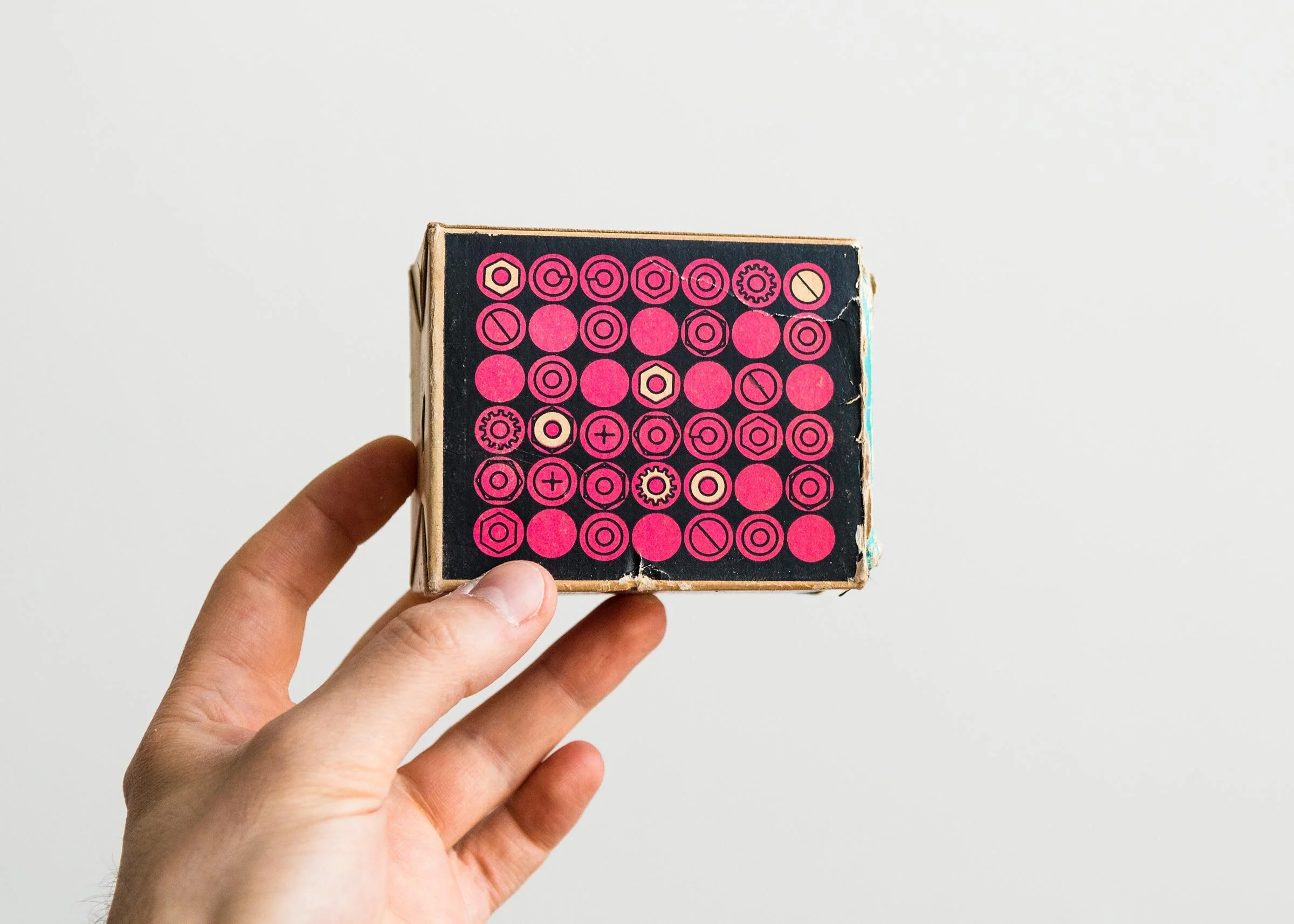 Vintage hardware box with illustration and pattern of nuts and bolts