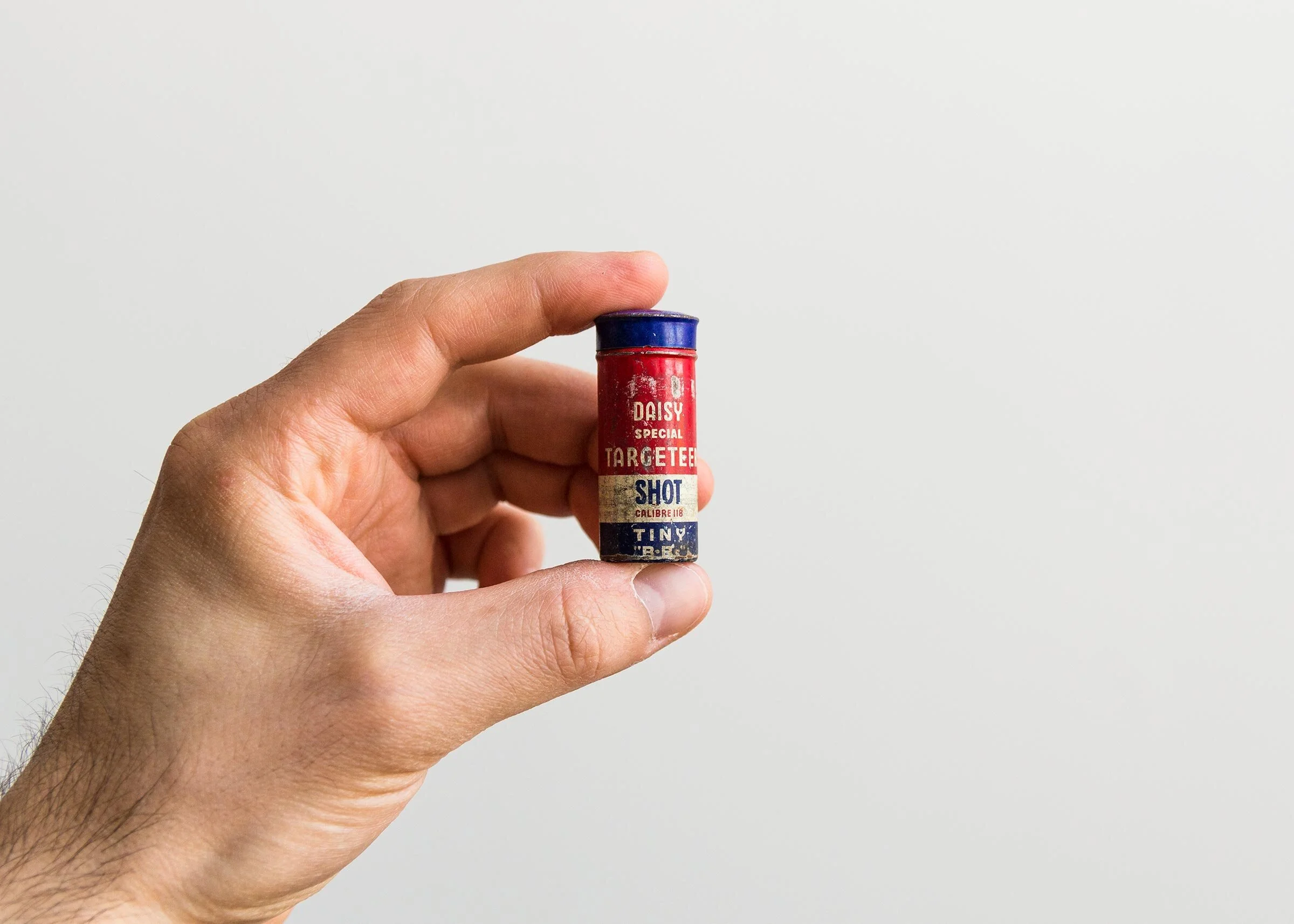 Vintage Daisy B.B.s ammo container with sans serif font