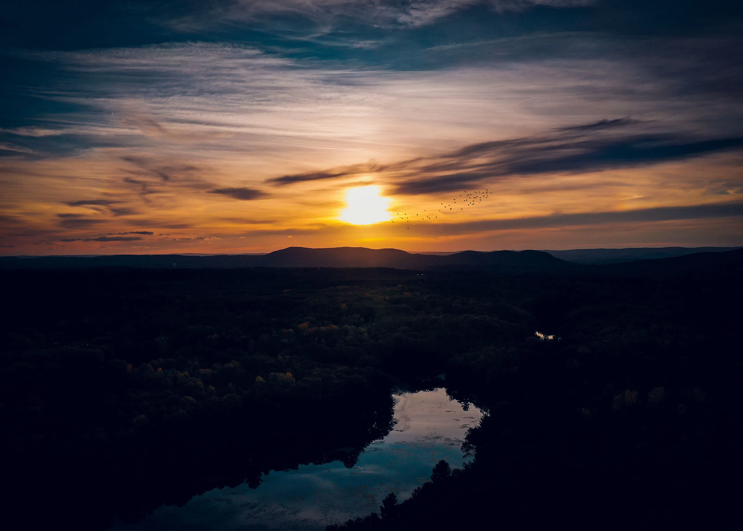 Sunset with birds shot with a drone Mavic 2 Pro
