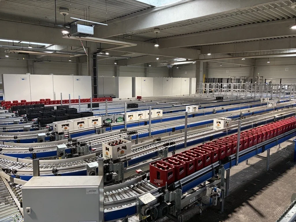 conveyer belts of reusable bottles being sorted