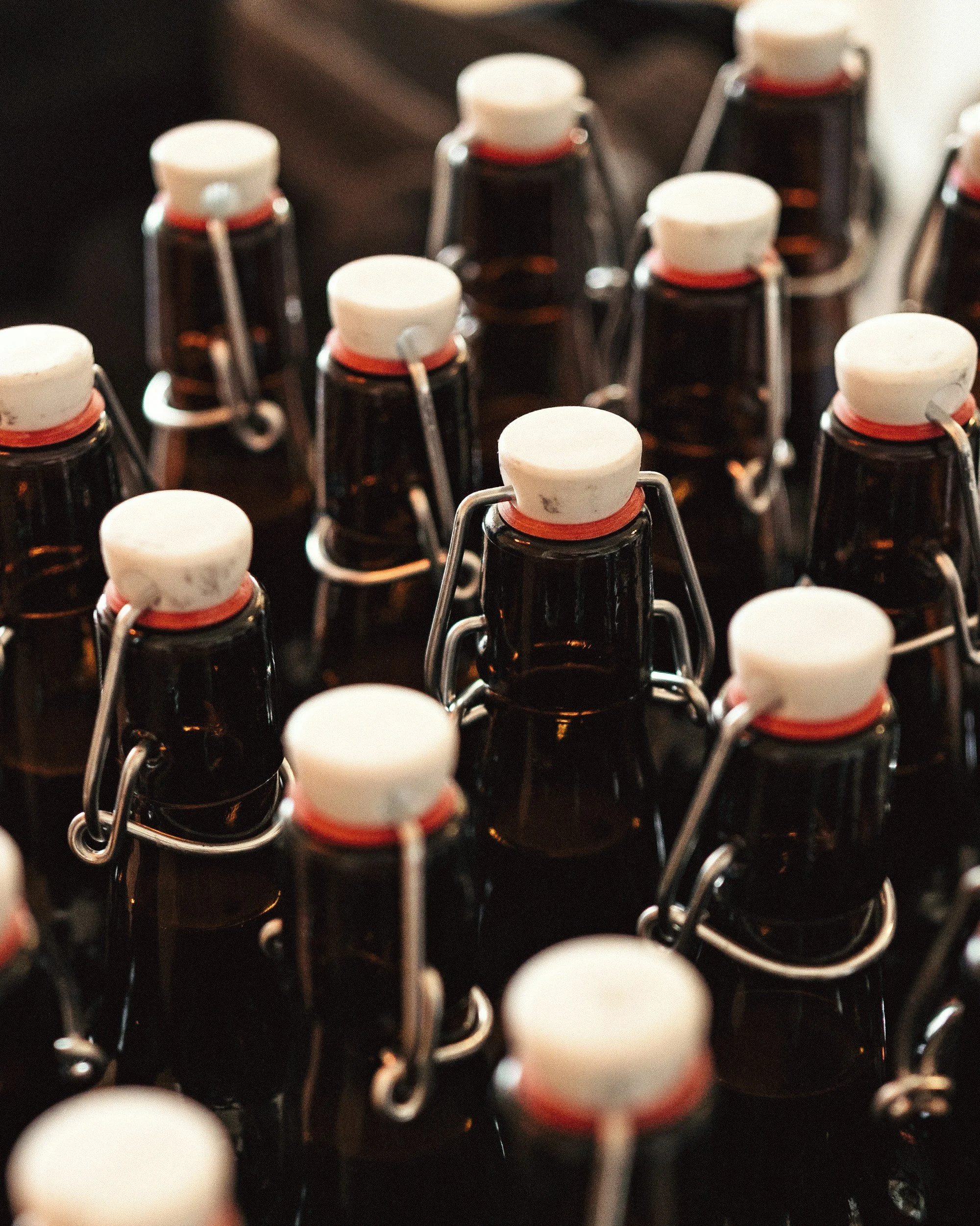 rows of brown glass bottles with stoppers