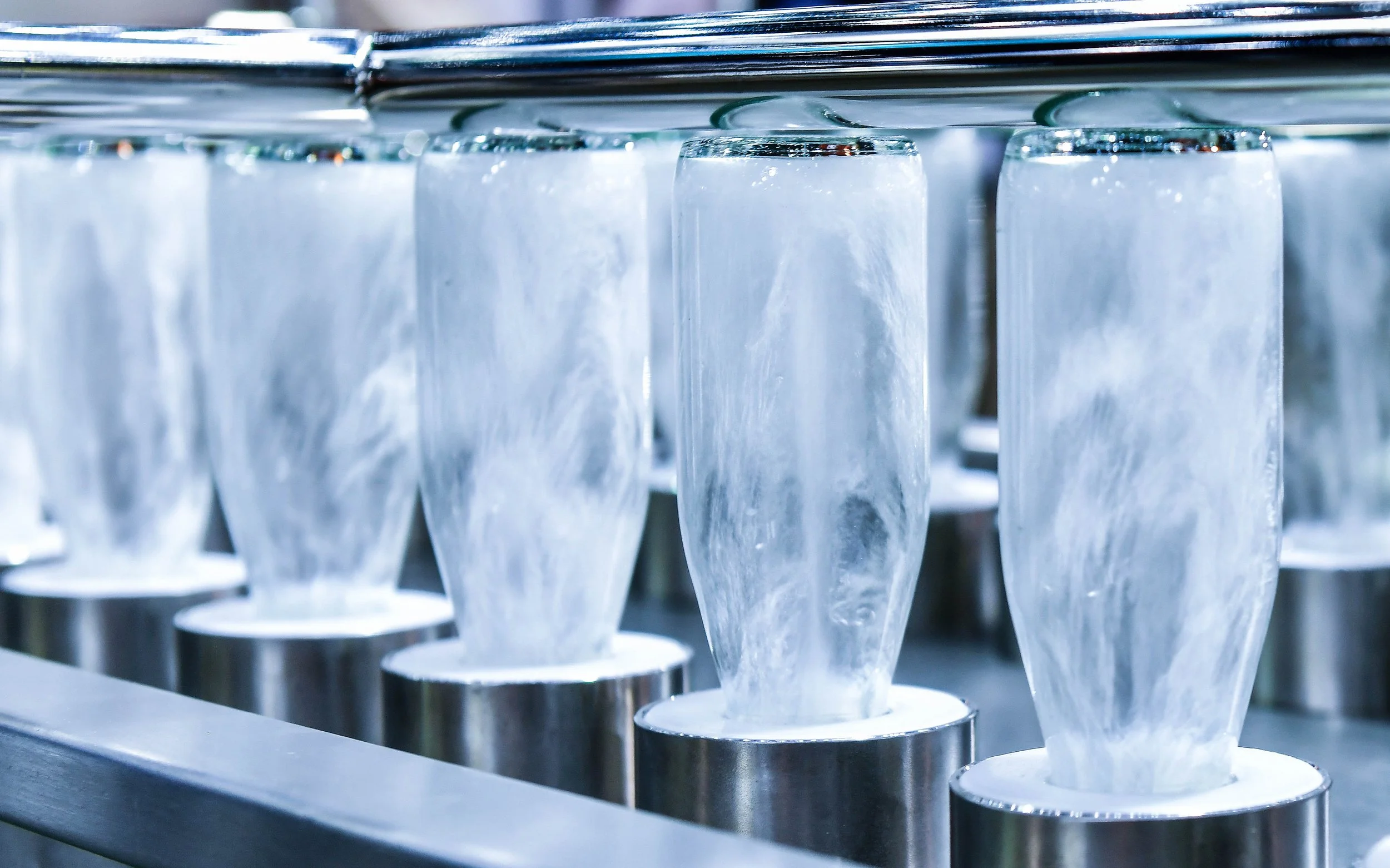 glass bottles being commercially washed