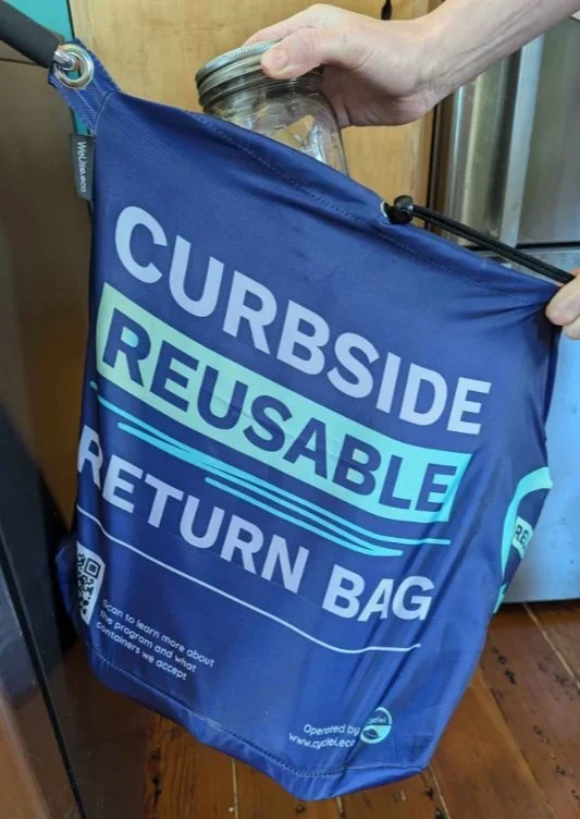 Reusable blue bag labelled Curbside Reusable Return bag