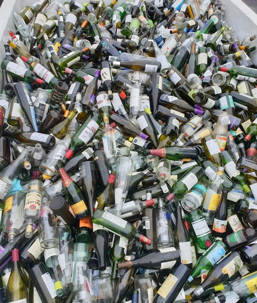 glass bottles in a bin
